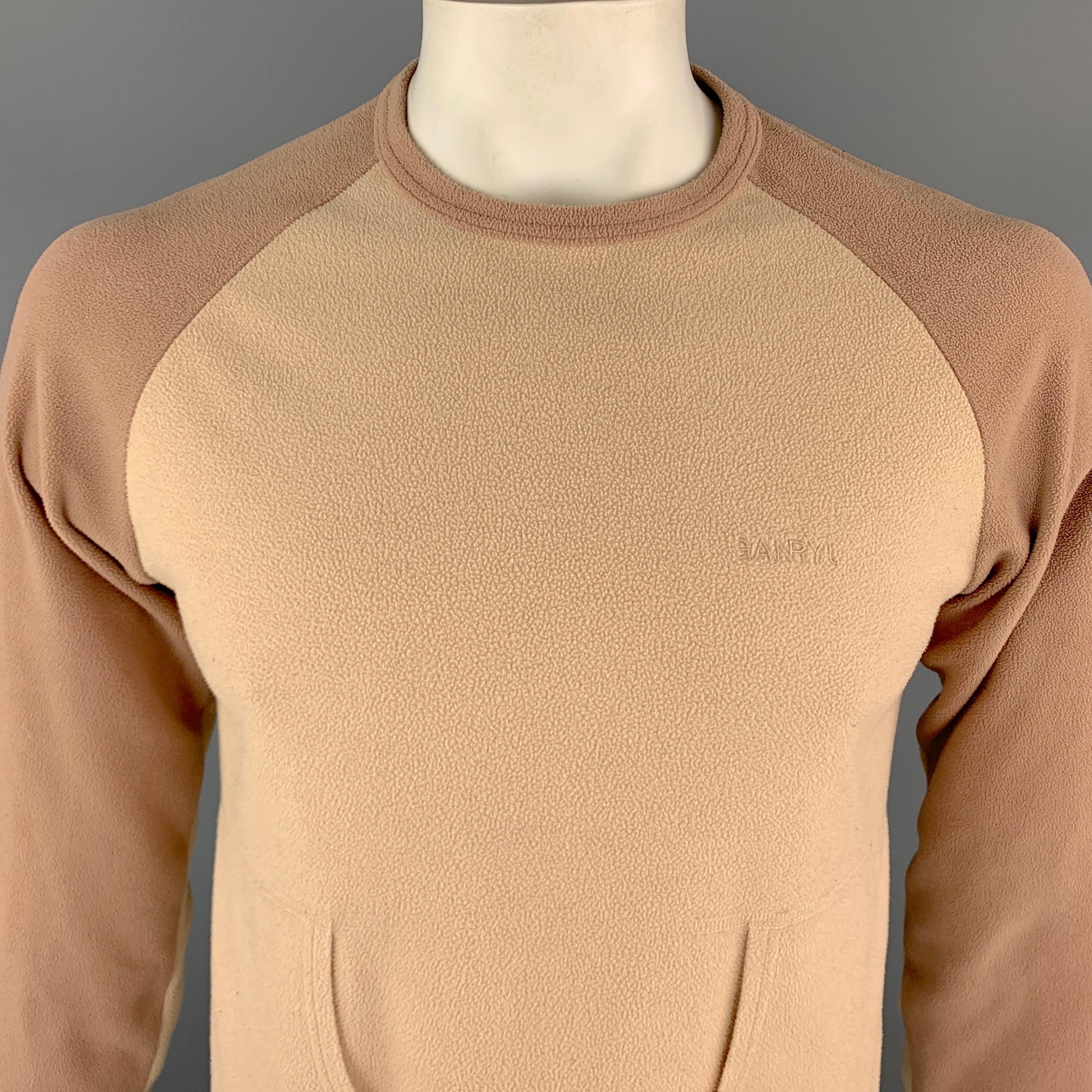 COMME des GARCONS GANRYU Pullover Sweater comes in beige and white tones, color block, in a cotton material, with a crewneck, raglan long sleeves, and patch pockets at front. As is. Made in Japan.

Good Pre-Owned Condition.
Marked: No
