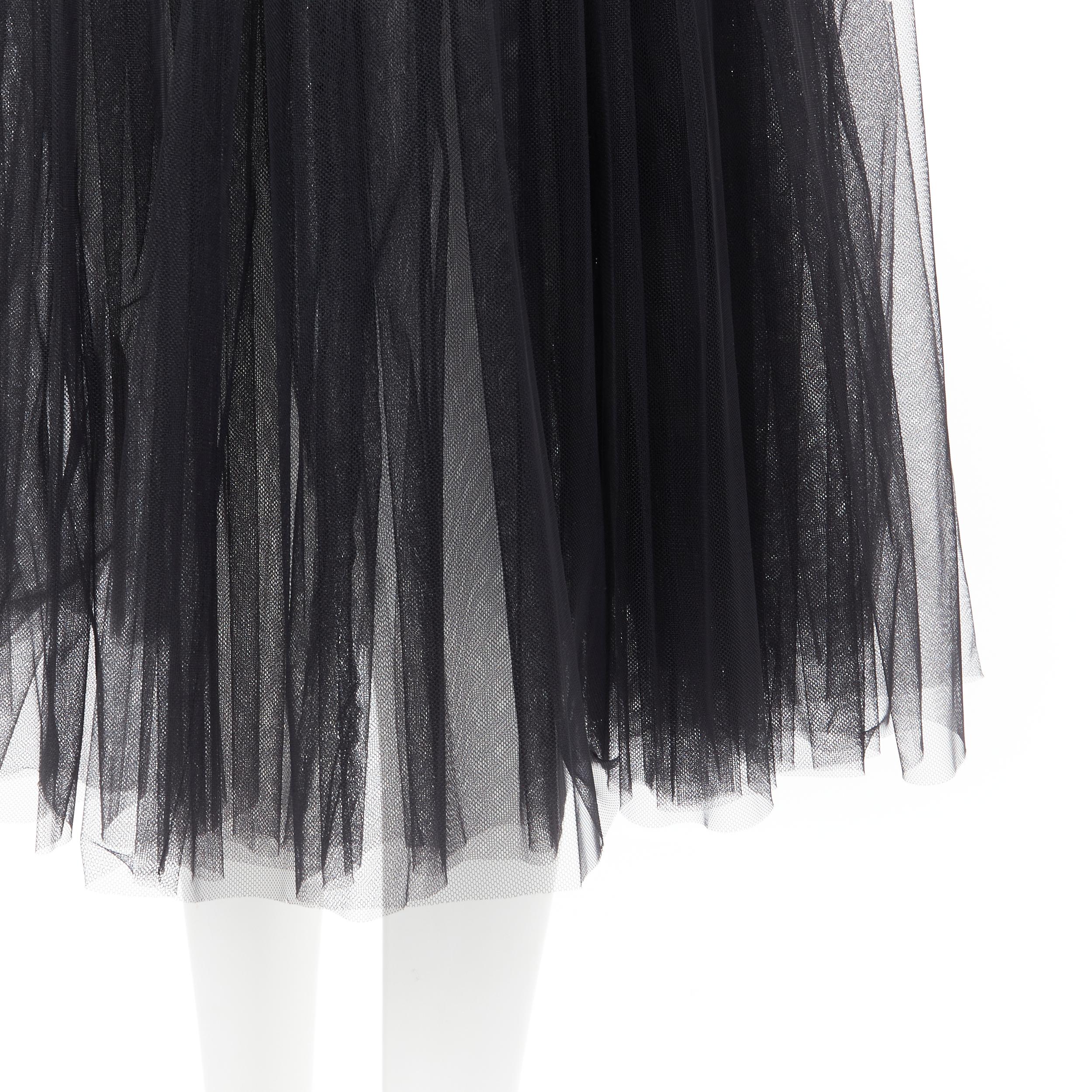 COMME DES GARCONS GIRL 2018 black tulle sheer flared skirt XS 
Reference: LNKO/A01796 
Brand: Comme Des Garcons 
Designer: Rei Kawakubo 
Material: Nylon 
Color: Blacks 
Pattern: Solid 
Extra Detail: Elasticated waist. 
Made in: Japan 

CONDITION: