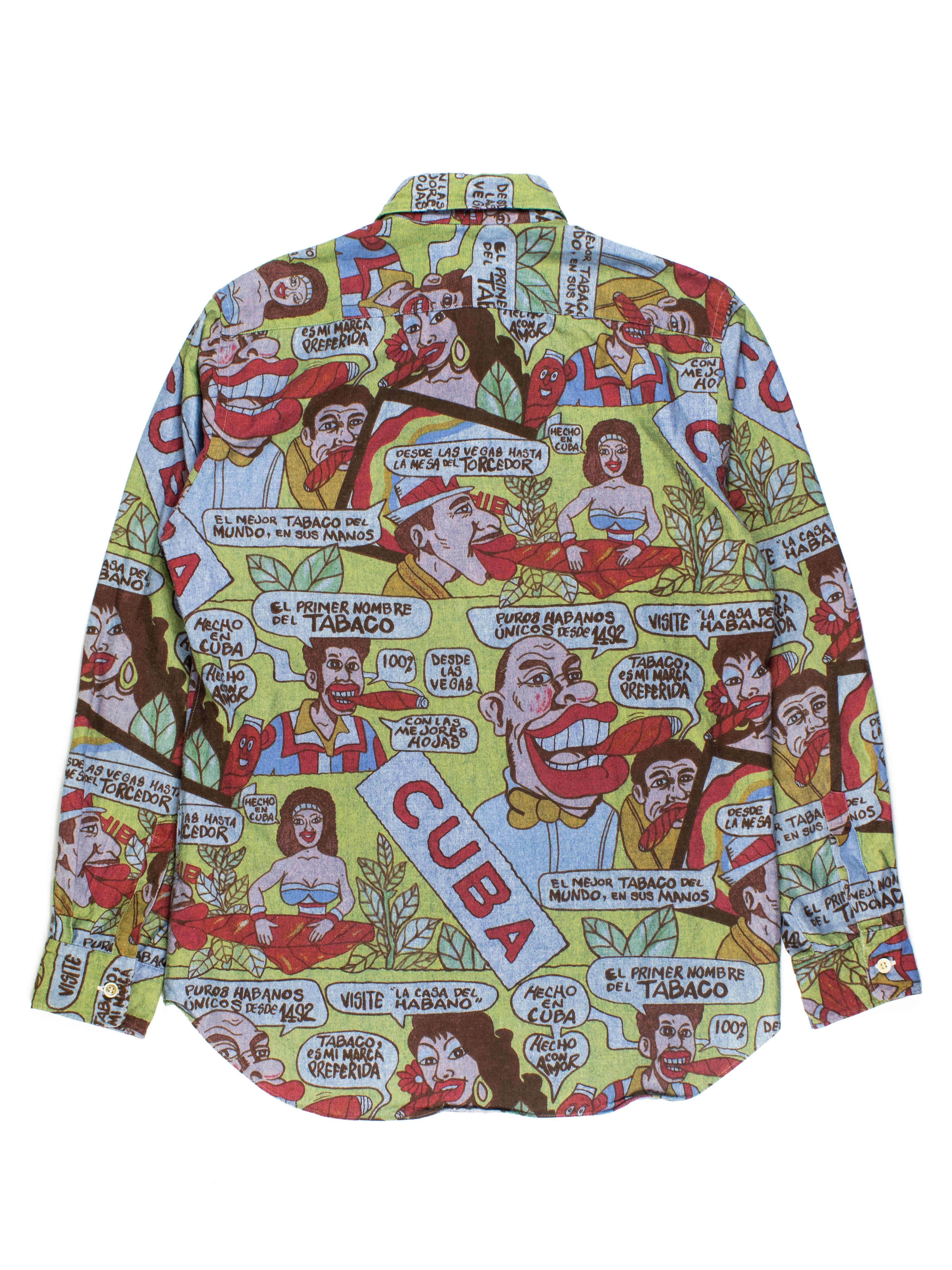This broadcloth cotton top employs a tropical color scheme and vintage comic book-style Cuban iconography to depict various interactions revolving around cigars - a symbol of pseudo-illicit luxury during the embargo (U.S. president John F. Kennedy
