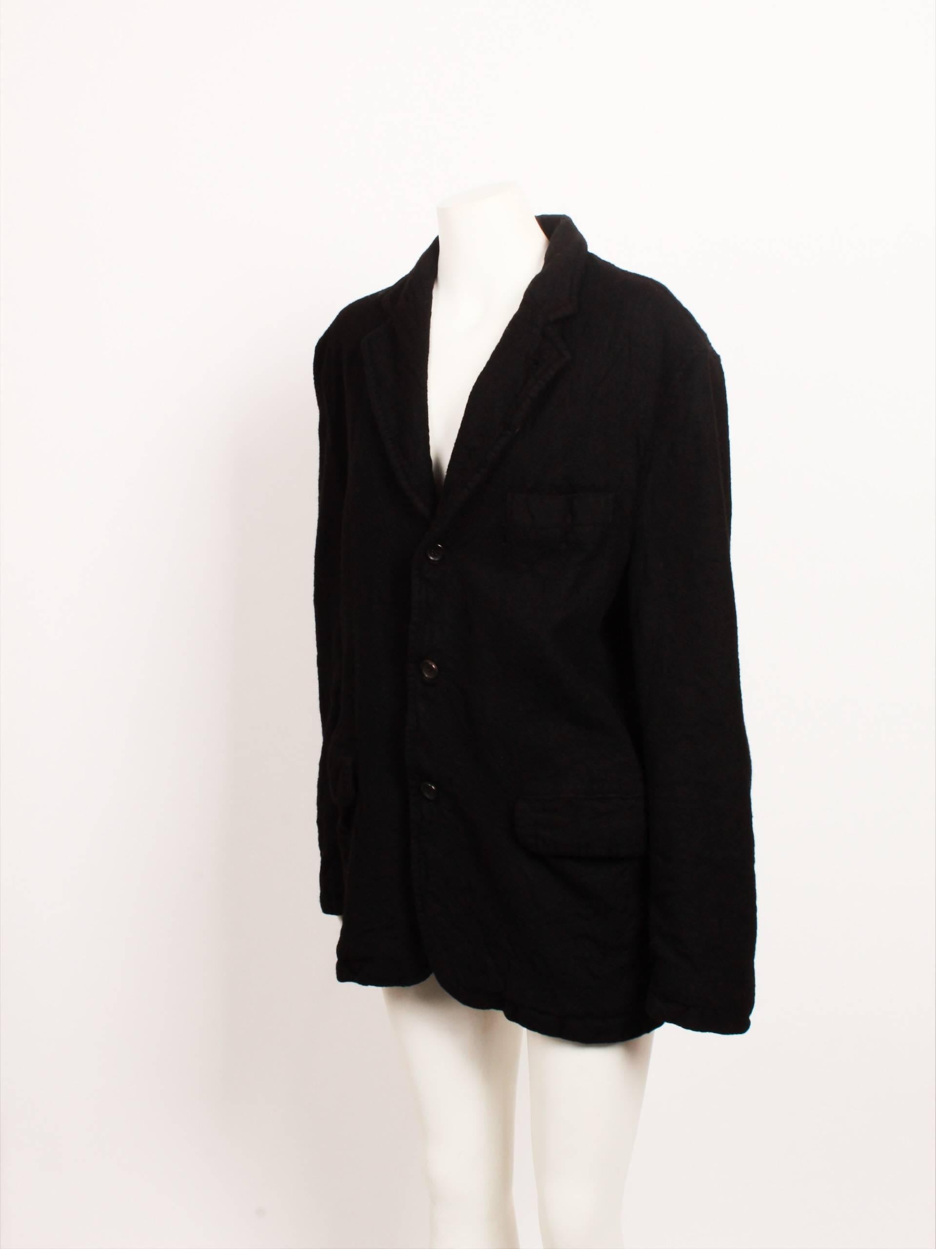 An amazing vintage Comme des Garcons Homme blazer made of heavy boiled wool fabric. The fabric's color is jet black. The jacket is garment-milled and heavily distressed.

The fabric is 100pc wool, lining 100pc cupro. AD 2004.
 The jacket is made in