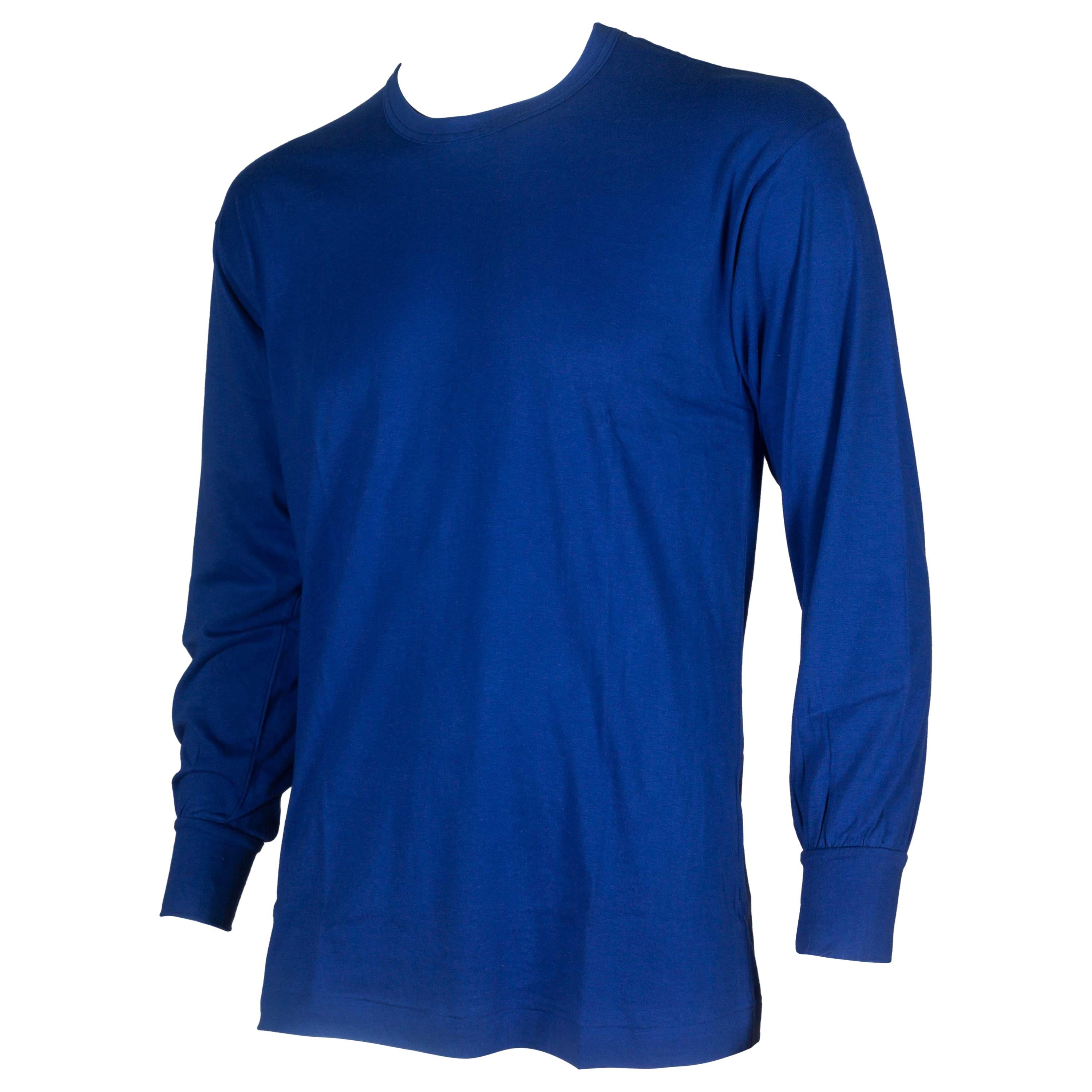 Comme des Garçons Homme 1989, a vibrant Klein blue cotton long sleeve jersey tee from Japan with text: 