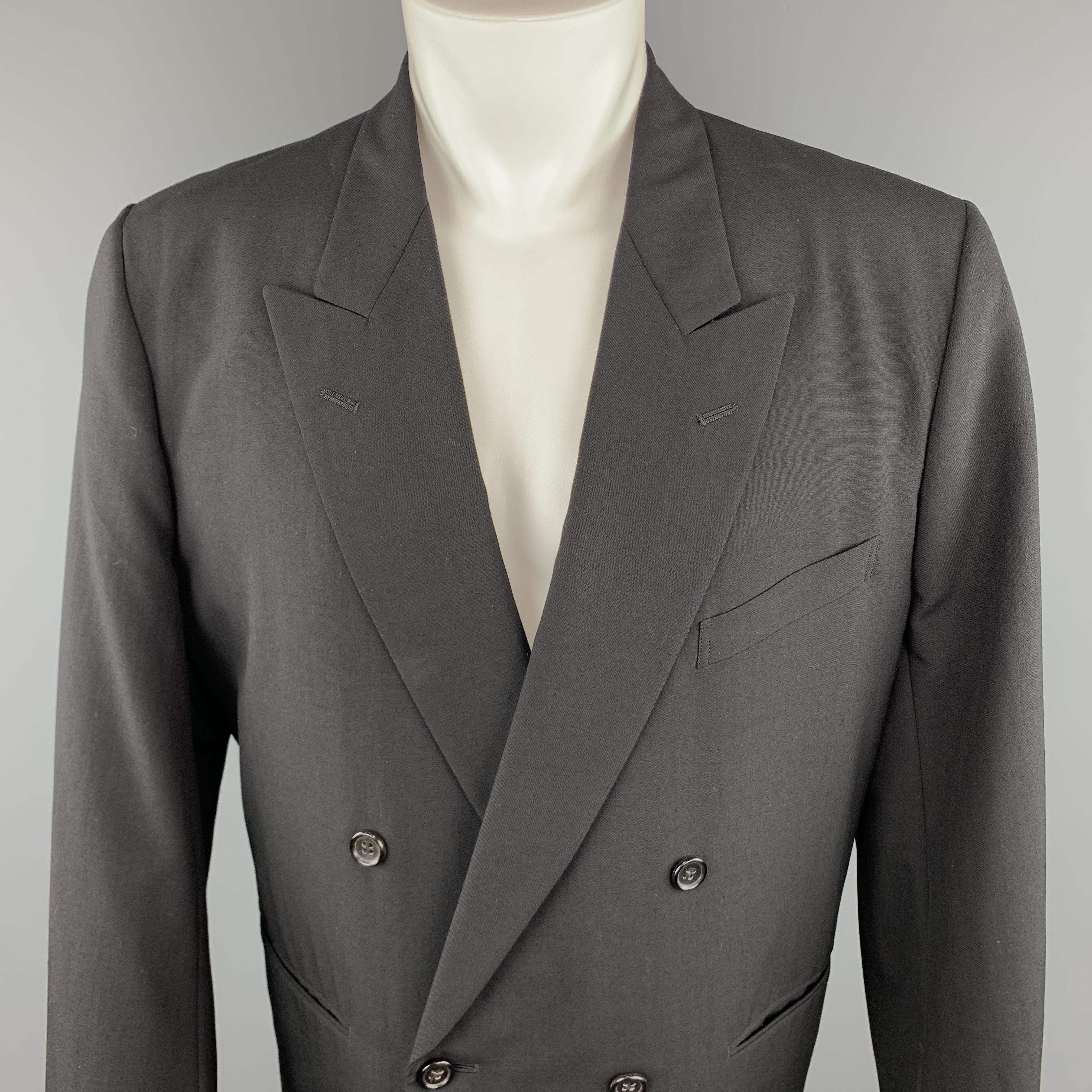 COMME des GARCONS HOMME PLUS Sport Coat comes in a black tone in a solid wool material, with a peak lapel, slit pockets, double breasted, buttoned cuffs, unlined.
 
Excellent Pre-Owned Condition.
Marked: S
 
Measurements:
 
Shoulder: 17 in.
Chest: