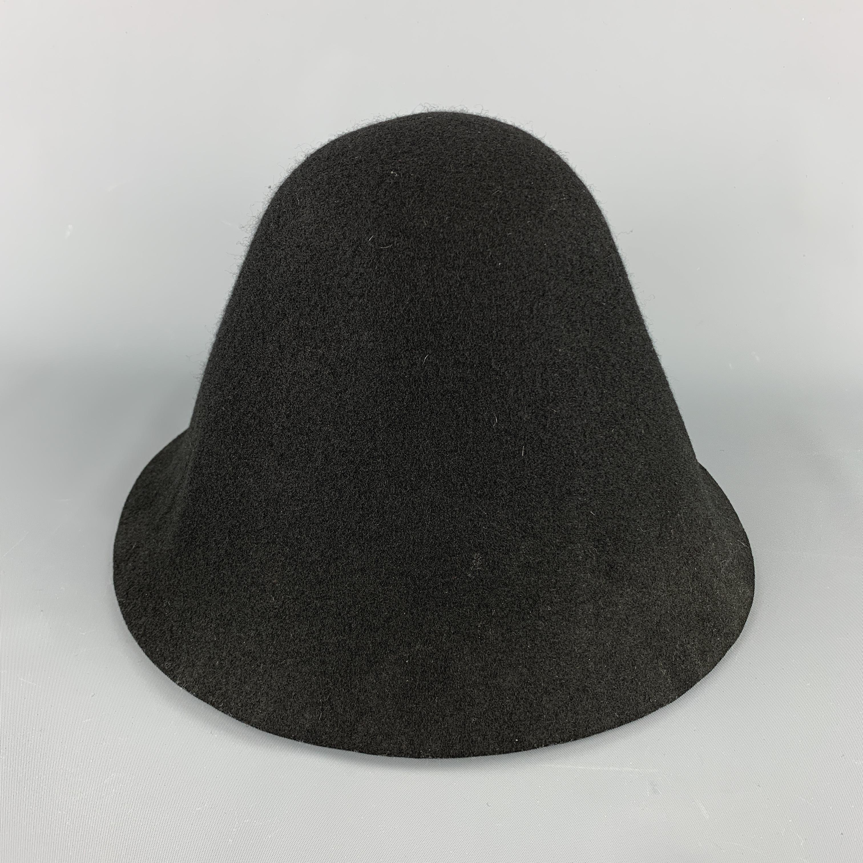 COMME des GARCONS HOMME PLUS structured hat comes in a solid black wool material. Made in Japan.

Excellent Pre-Owned Condition.
Marked: no size.

Measurements:

Opening: 13 x 12.5 in.
Height: 9.5 in. 