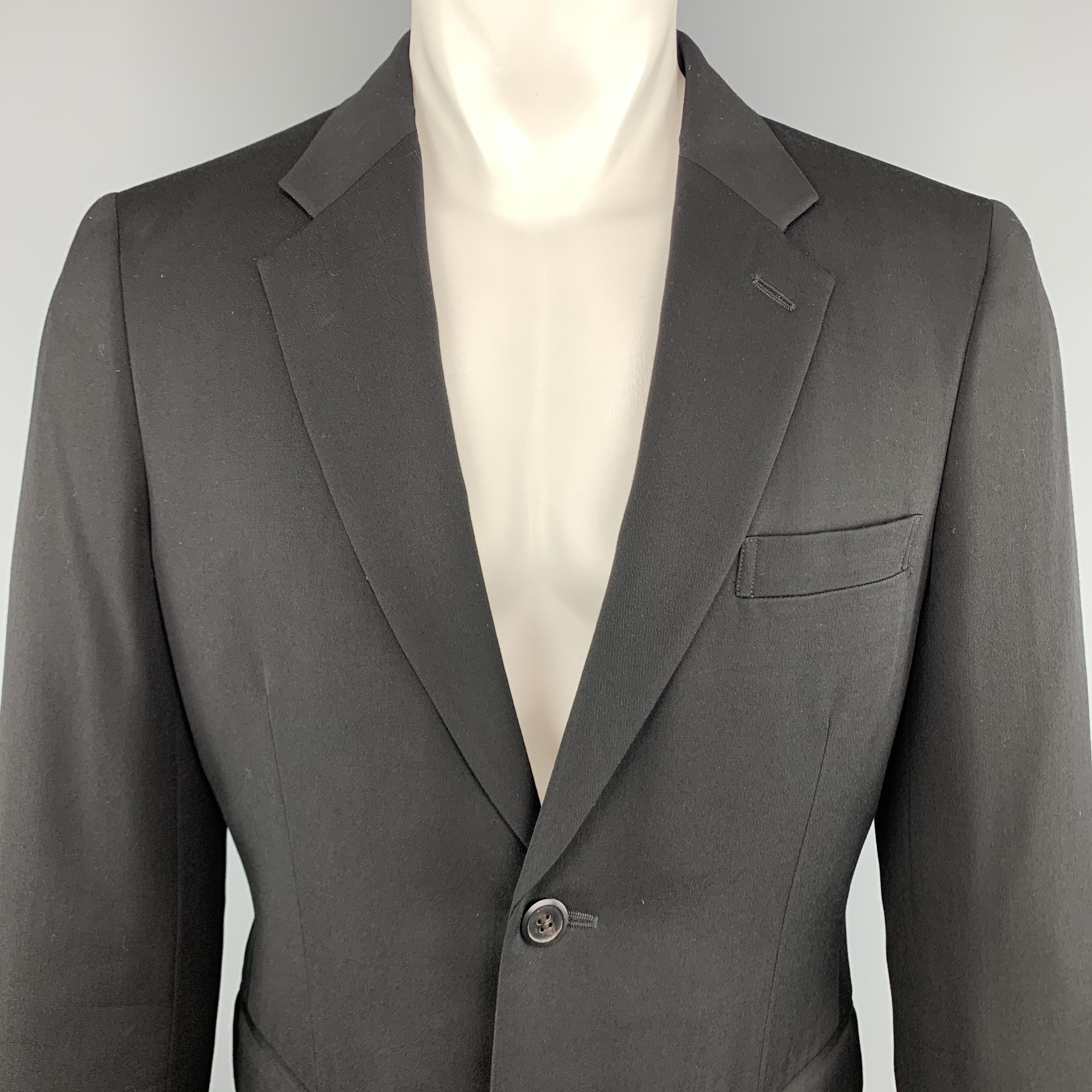 COMME des GARCONS HOMME PLUS sport coat jacket comes in black wool with a notch lapel, two button single breasted front, and raw edge deconstructed cut out hem line. Made in Japan.
 
Excellent Pre-Owned Condition.
Marked: M  AD2015
 
Measurements:
