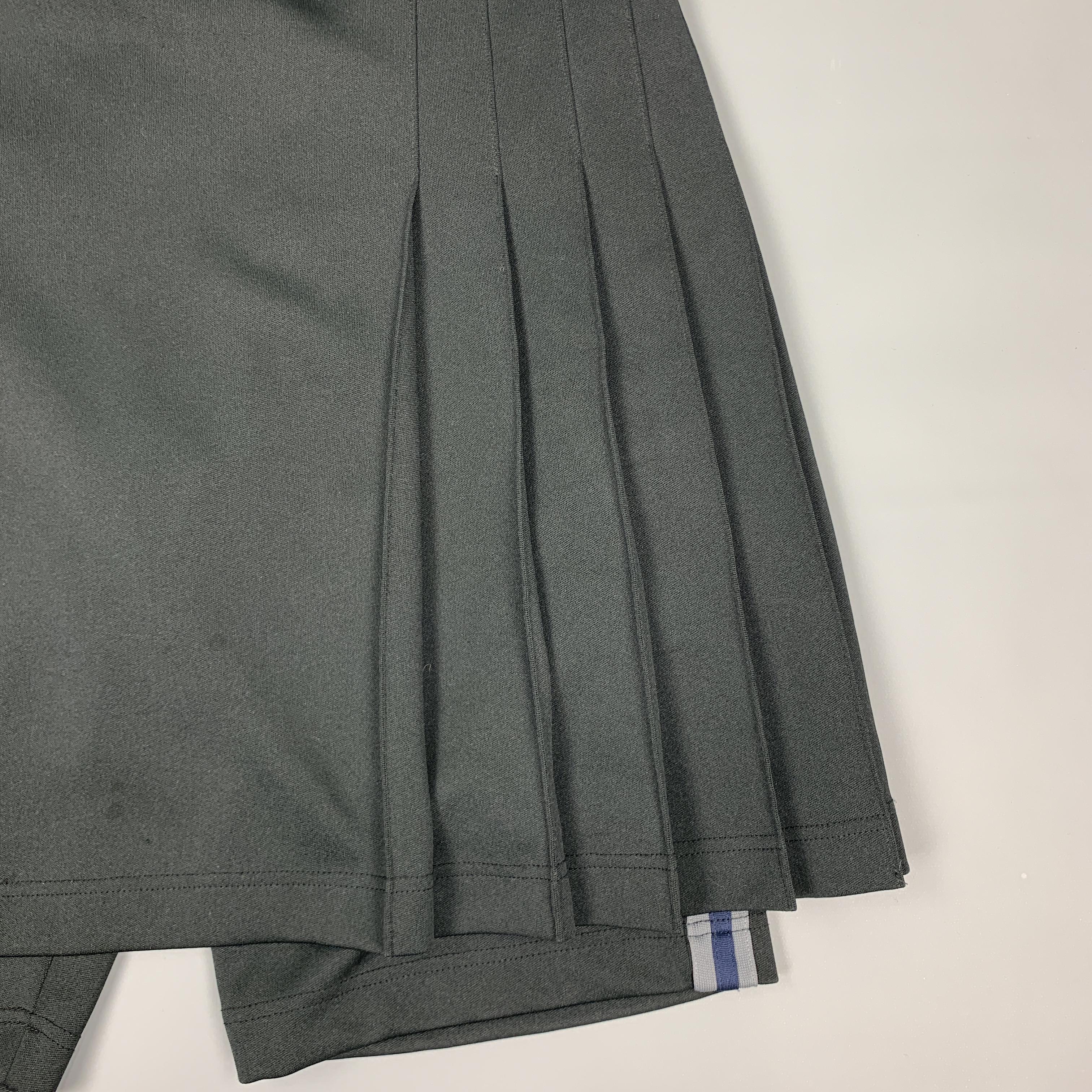 COMME des GARCONS HOMME PLUS skort shorts come in black knit fabric with blue and grey webbing stripe sides and pleated kilt overlay panel with buckle closure.
 
Excellent Pre-Owned Condition.
Marked: S
 
Measurements:
 
Waist: 32 in.
Rise: 12