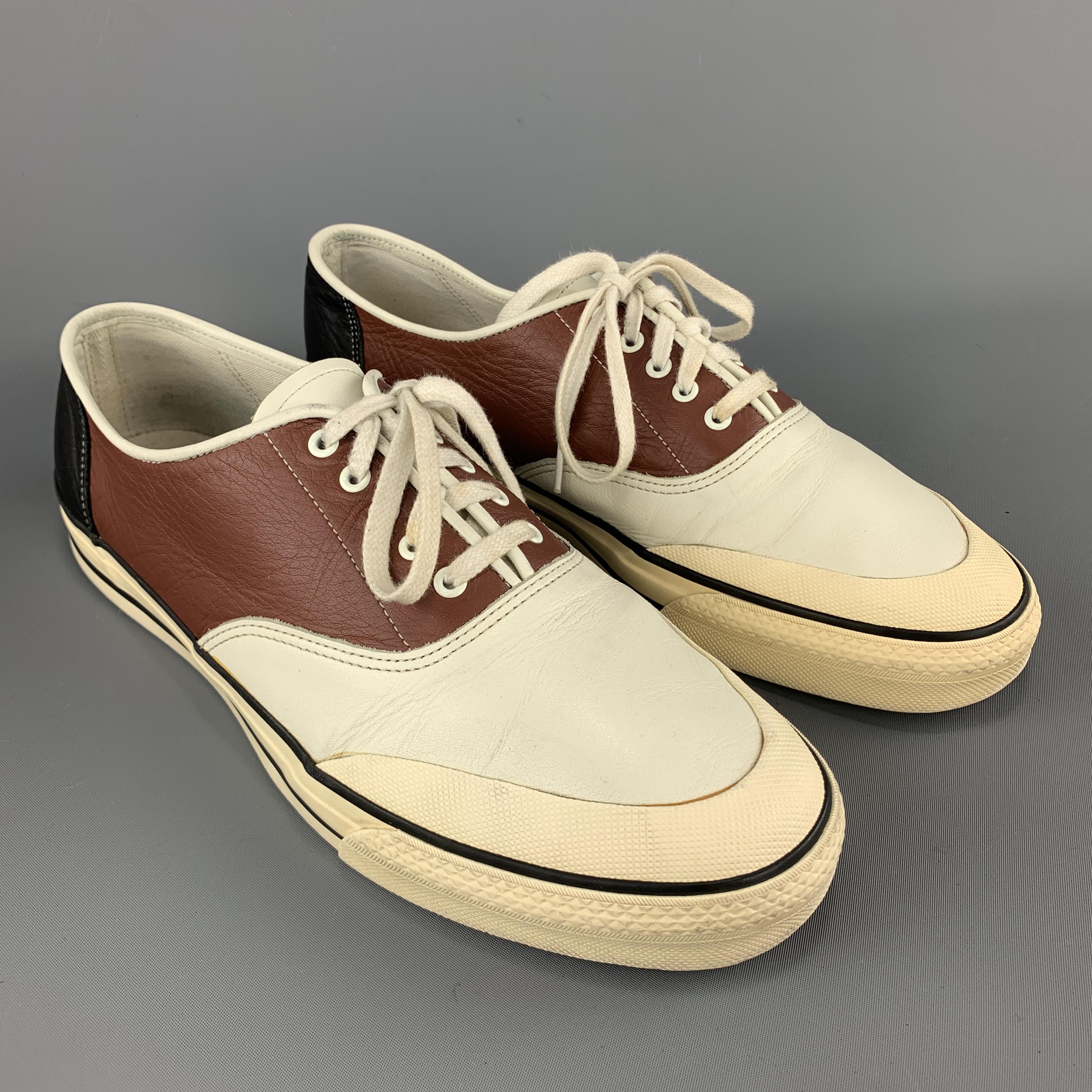 COMME des GARCONS HOMME PLUS Converse inspired low top sneakers come in brown leather with a cream toe panel, black heel panel, and beige rubber sole. With Box. Made in Japan.

Very Good Pre-Owned Condition.
Marked: 26.0

Outsole: 11 x 4 in.