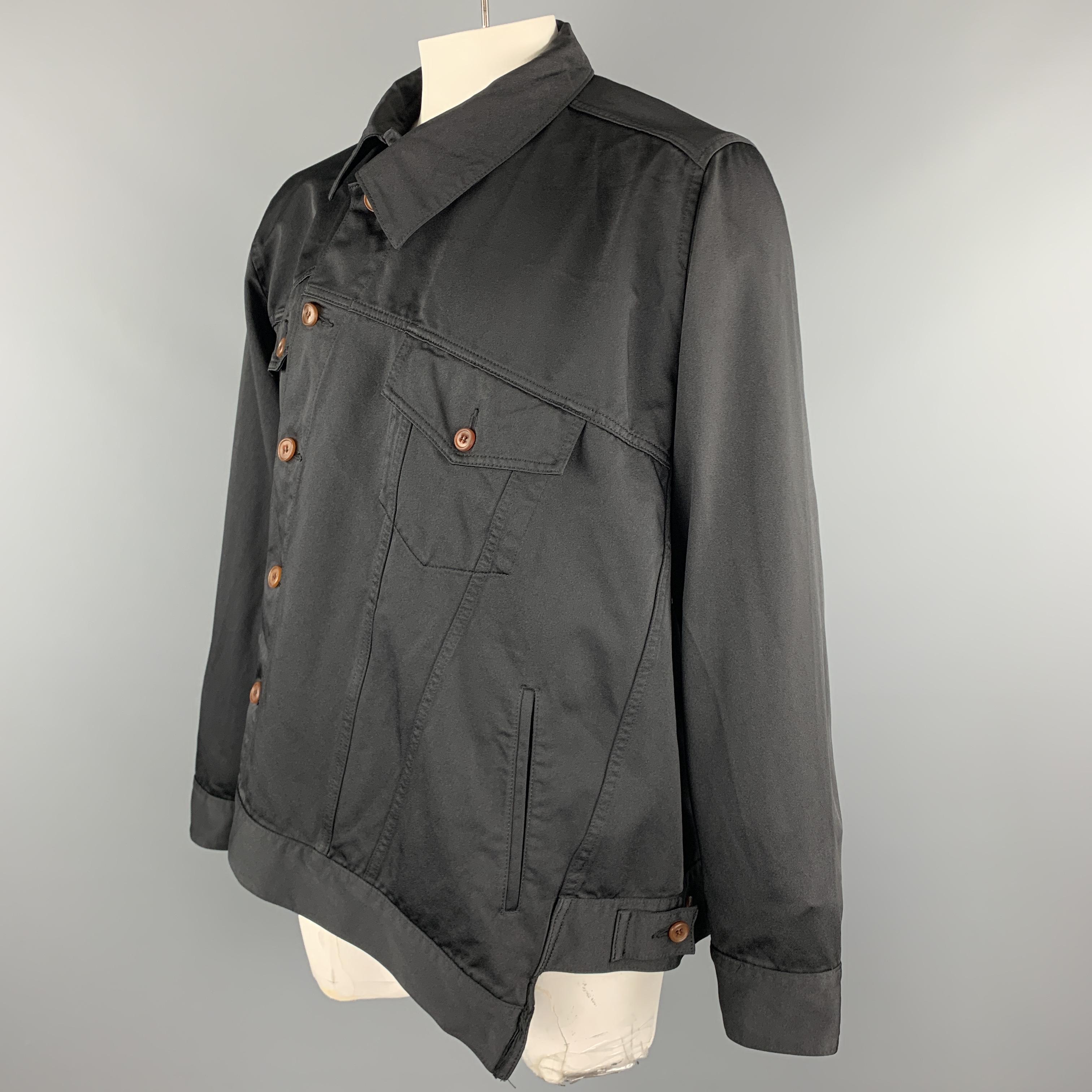 COMME des GARCONS HOMME PLUS Fall Winter 2018 Collection trucker jacket comes in black shiny gabardine with am oversized silhouette, patch flap pockets, shifted collar, and asymmetrical button front. Made in Japan.

Excellent Pre-Owned