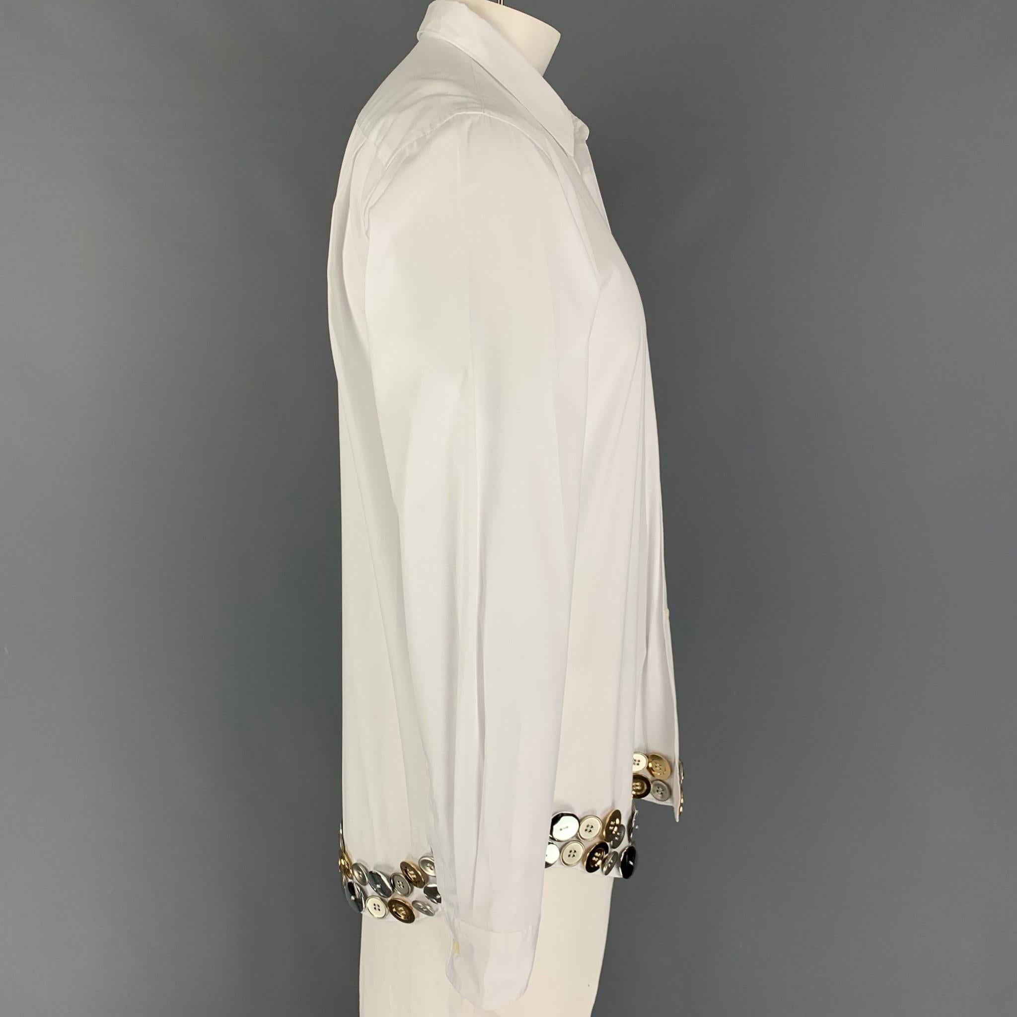 COMME des GARCONS HOMME PLUS long sleeve shirt comes in a white cotton featuring metal button details, patch pocket, spread collar, and a button up closure. Made in Japan. 

New With Tags. 
Marked: L

Measurements:

Shoulder: 19.5 in.
Chest: 42