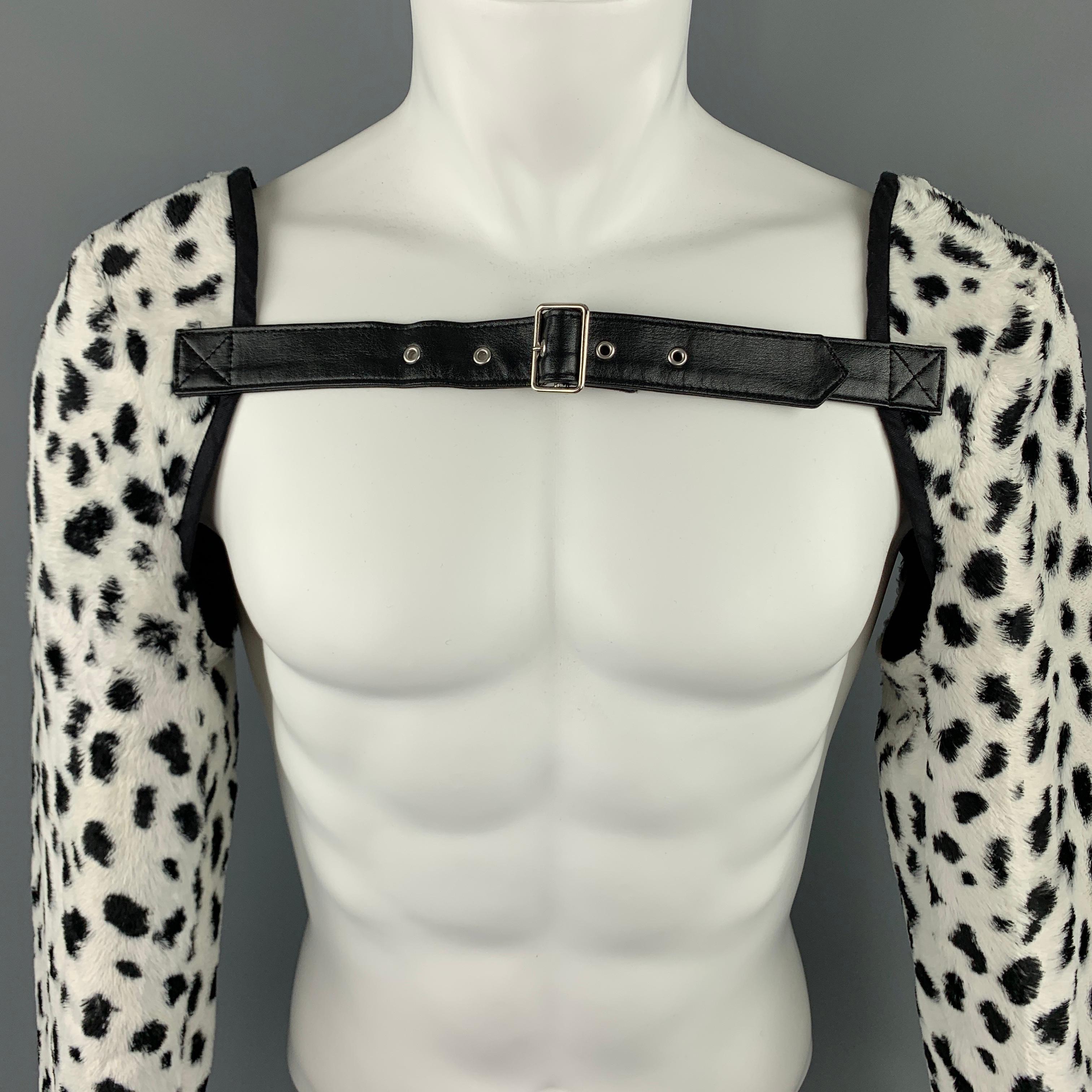 COMME des GARCONS HOMME PLUS sleeves harness, in an animal print faux fur rayon material, featuring leather straps and buckles for fitting, with buttoned cuffs and a black trim. Made in Japan.

Excellent Pre-Owned Condition.
Marked: