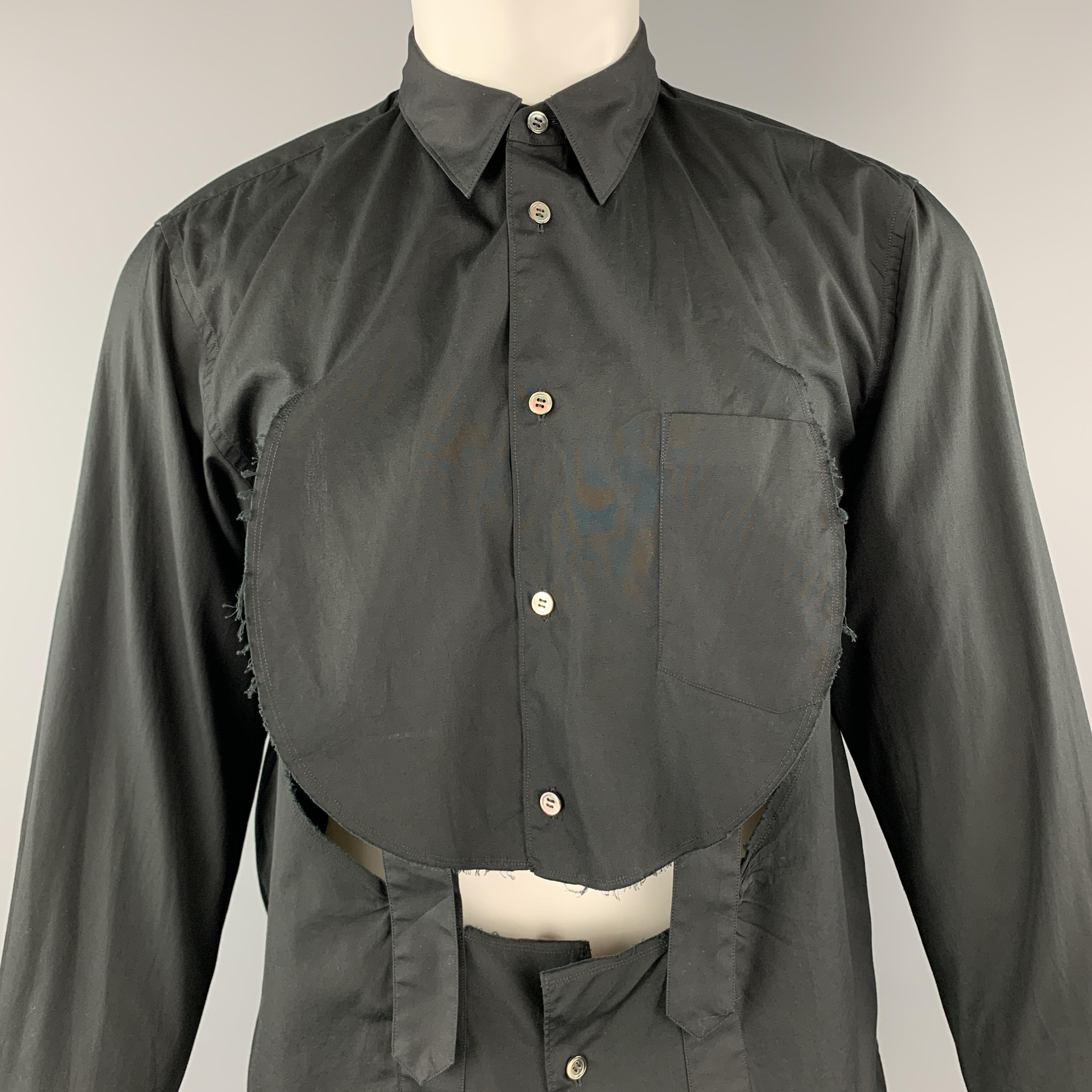 COMME DES GARCONS HOMME PLUS shirt comes in black cotton with a pointed collar, circle cutout flap front with bondage straps and a patch pocket. Made in Japan.

New with Tags.
Marked: M  AD 2018

Measurements:

Shoulder: 18 in.
Chest: 44 in.
Sleeve: