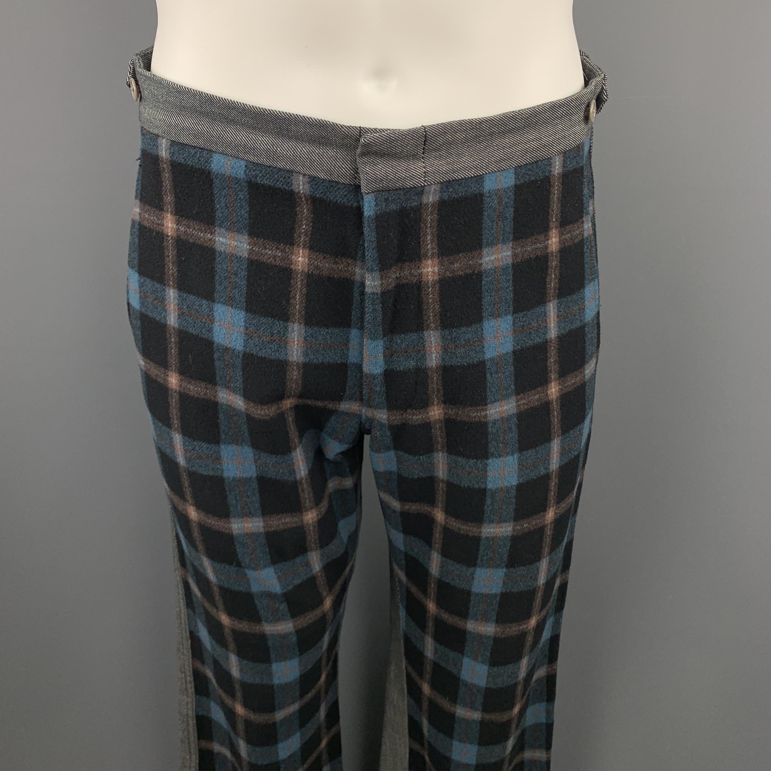 Archive COMME des GARCONS HOMME PLUS pants come in gray denim with side tabs, and navy, blue, and brown plaid wool blend front. Made in Japan.

Excellent Pre-Owned Condition.
Marked: M

Measurements:

Waist: 32.5 in.
Rise: 11.5 in.
Inseam: 32 in.