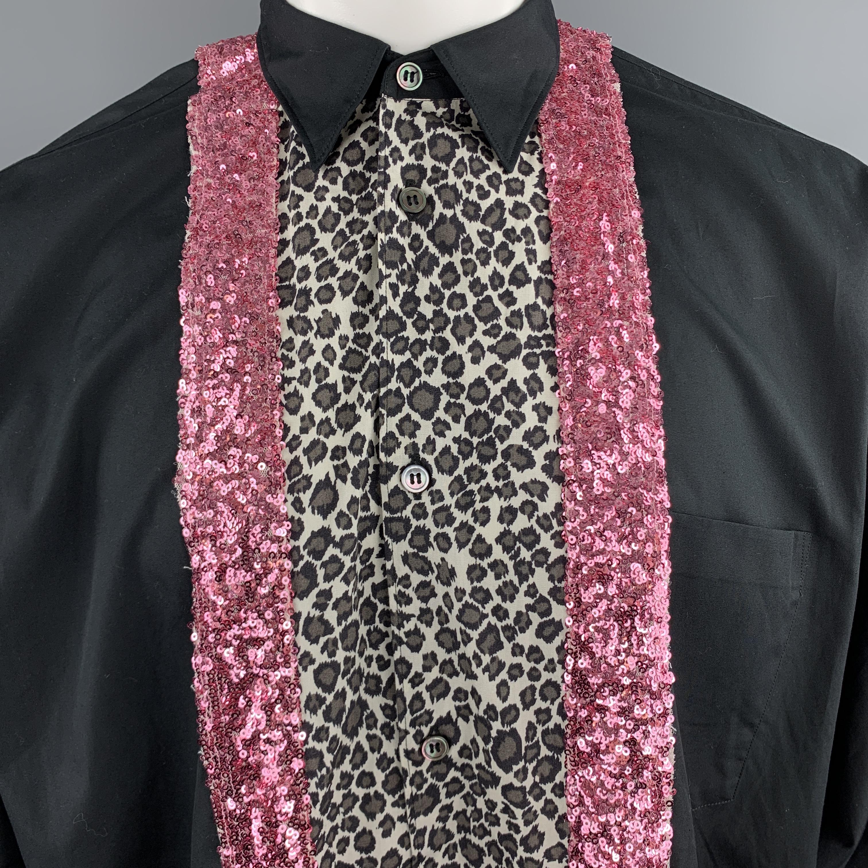 COMME des GARCONS HOMME PLUS shirt comes in black cotton with a pointed collar, oversized fit, patch breast pocket, and leopard and pink sequined patchwork stripes. Made in Japan.

Excellent Pre-Owned Condition.
Marked: S