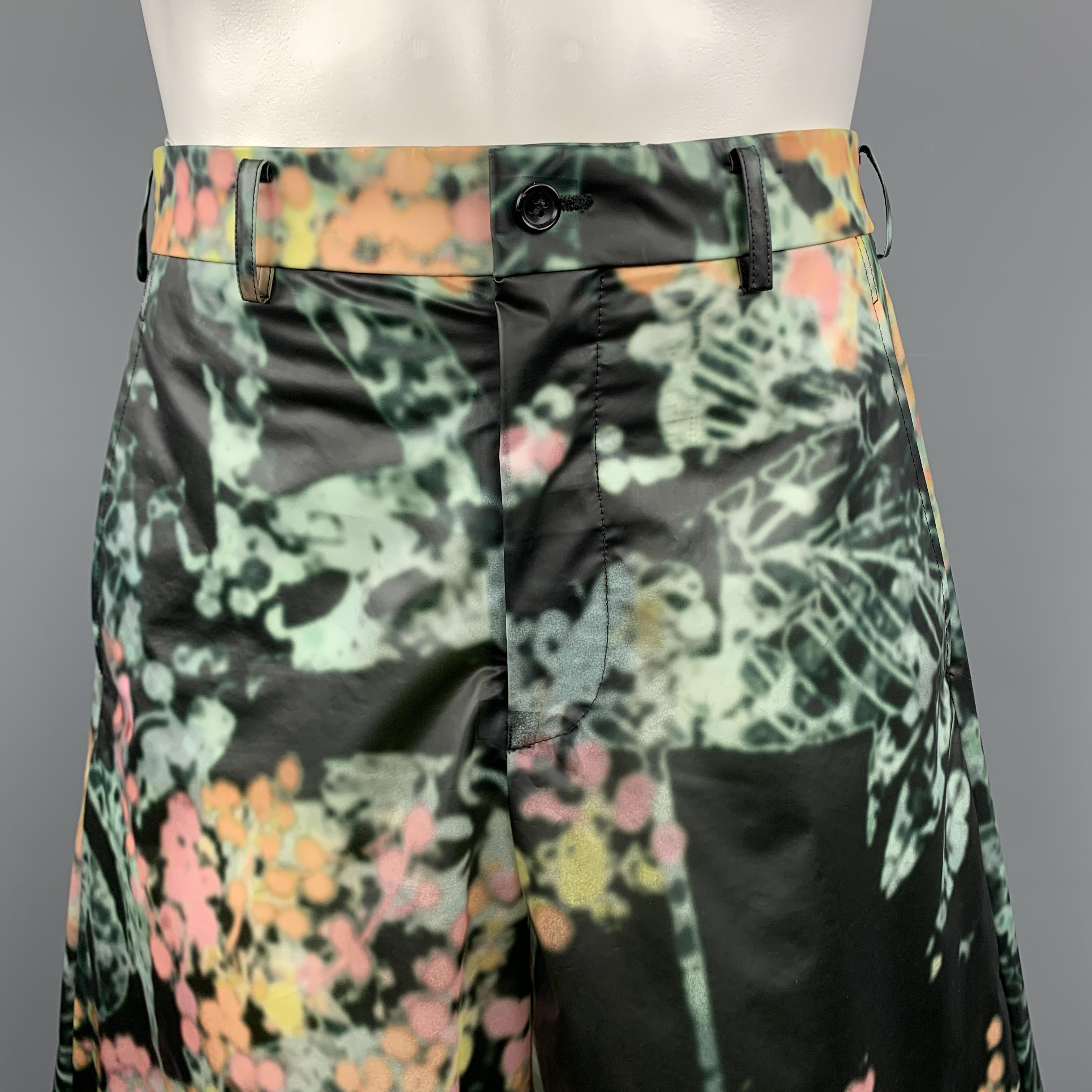 COMME des GARCONS HOMEM PLUS bermuda shorts come in black semi sheer PVC with an all over teal green, yellow, pink, and orange abstract marbled floral pattern and wide leg. Made in Japan.

Excellent Pre-Owned Condition.
Marked: S  AD