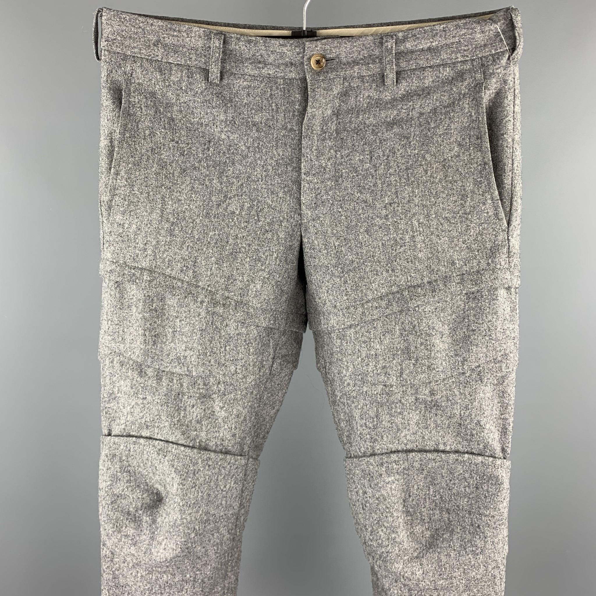 COMME des GARCONS HOMME PLUS dress pants comes in a grey wool featuring a cropped style, stitched details, and a zip fly closure. Made in Japan. 

Excellent Pre-Owned Condition.
Marked: JP S / AD2016

Measurements:

Waist: 32 in. 
Rise: 8 in.