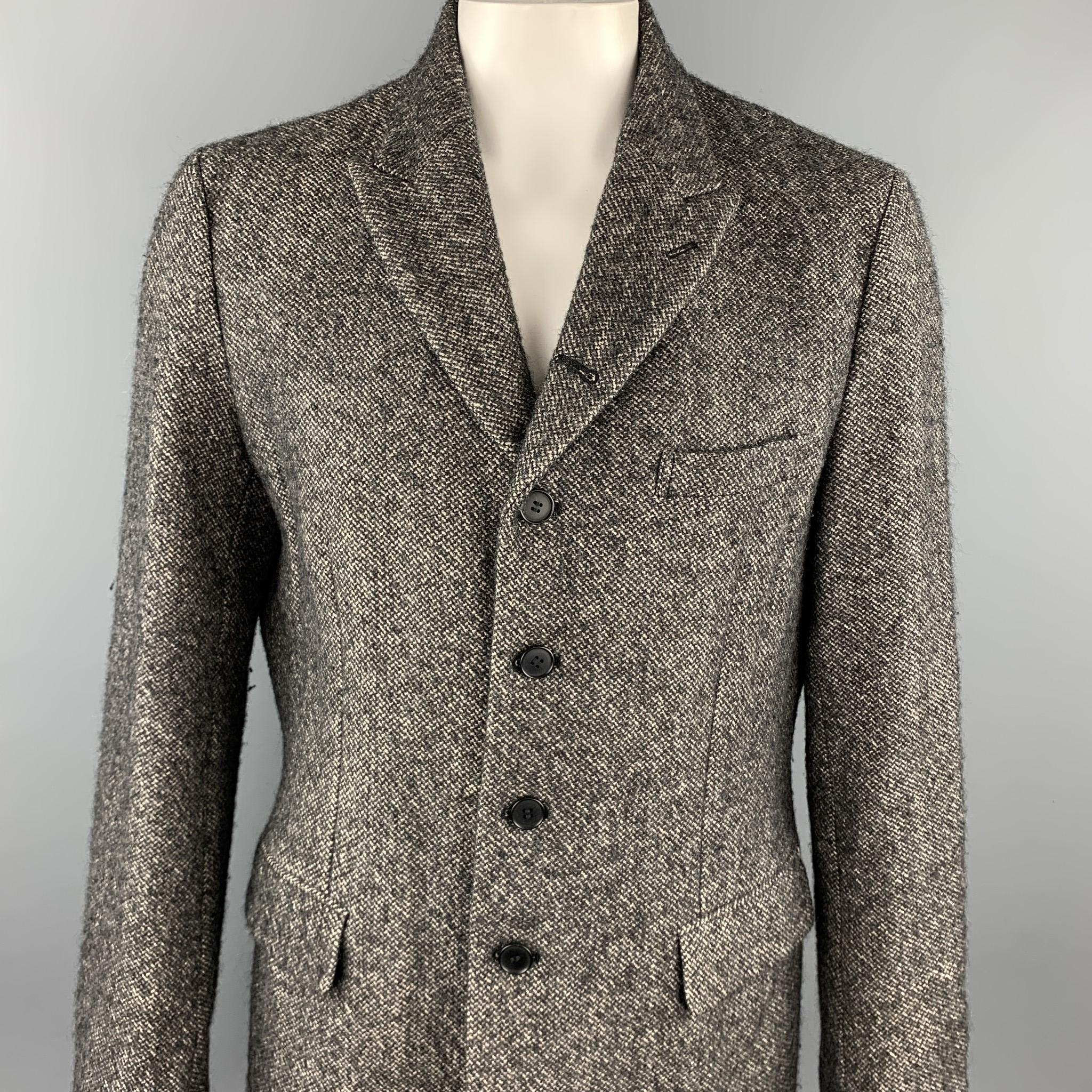 COMME des GARCONS HOMME PLUS coat comes in a taupe & black tweed linen / wool featuring a peak lapel, flap pockets, and a buttoned closure. Minor wear. As-Is. Made in Japan.

Very Good Pre-Owned Condition.
Marked: XL

Measurements:

Shoulder: 19 in.