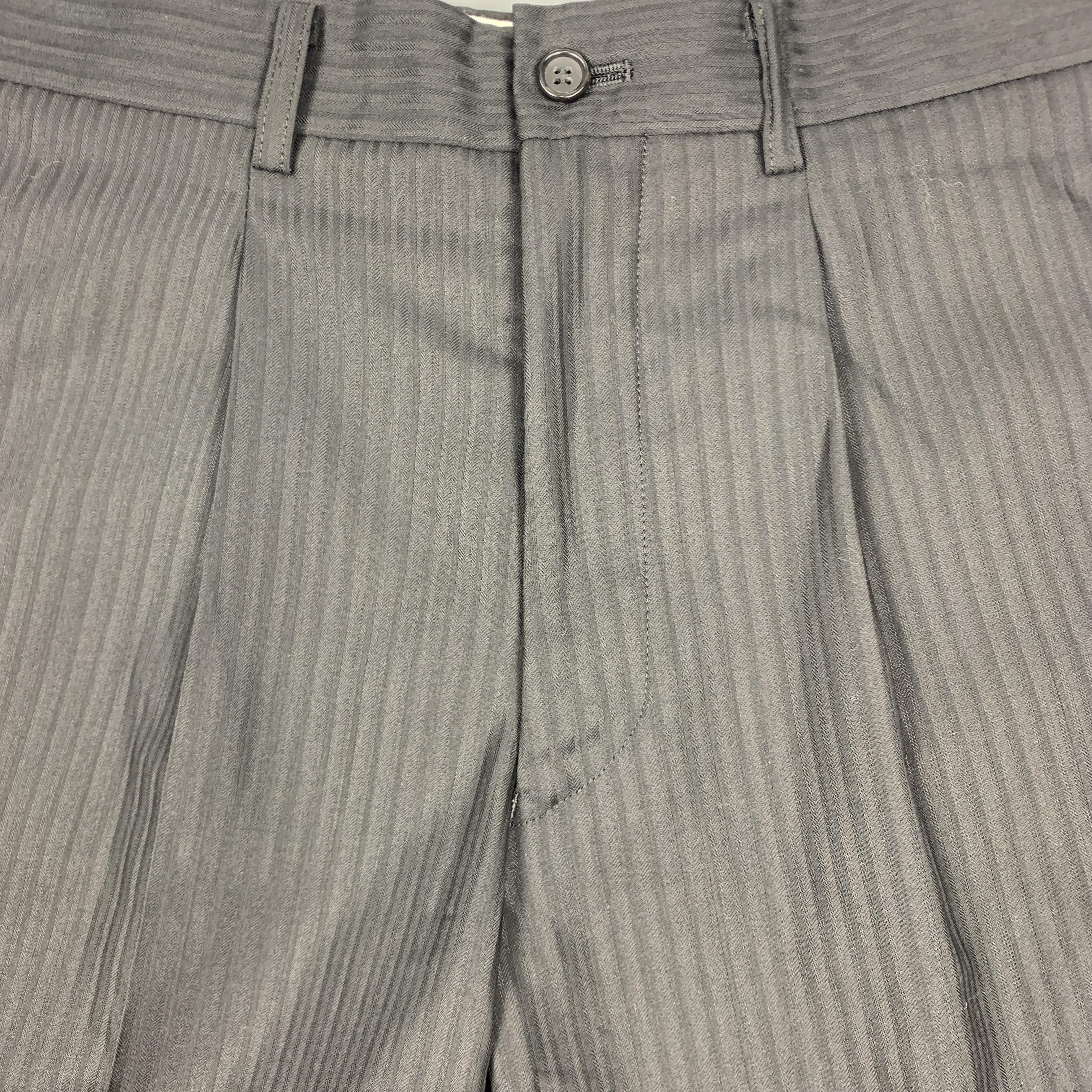 COMME des GARCONS HOMME PLUS Bermuda shorts come in black wool silk blend stripe textured fabric with a single pleat and tan leopard print side panels. Made in Japan.
 
Excellent Pre-Owned Condition.
Marked: XS
 
Measurements:
 
Waist: 31 in.
Rise: