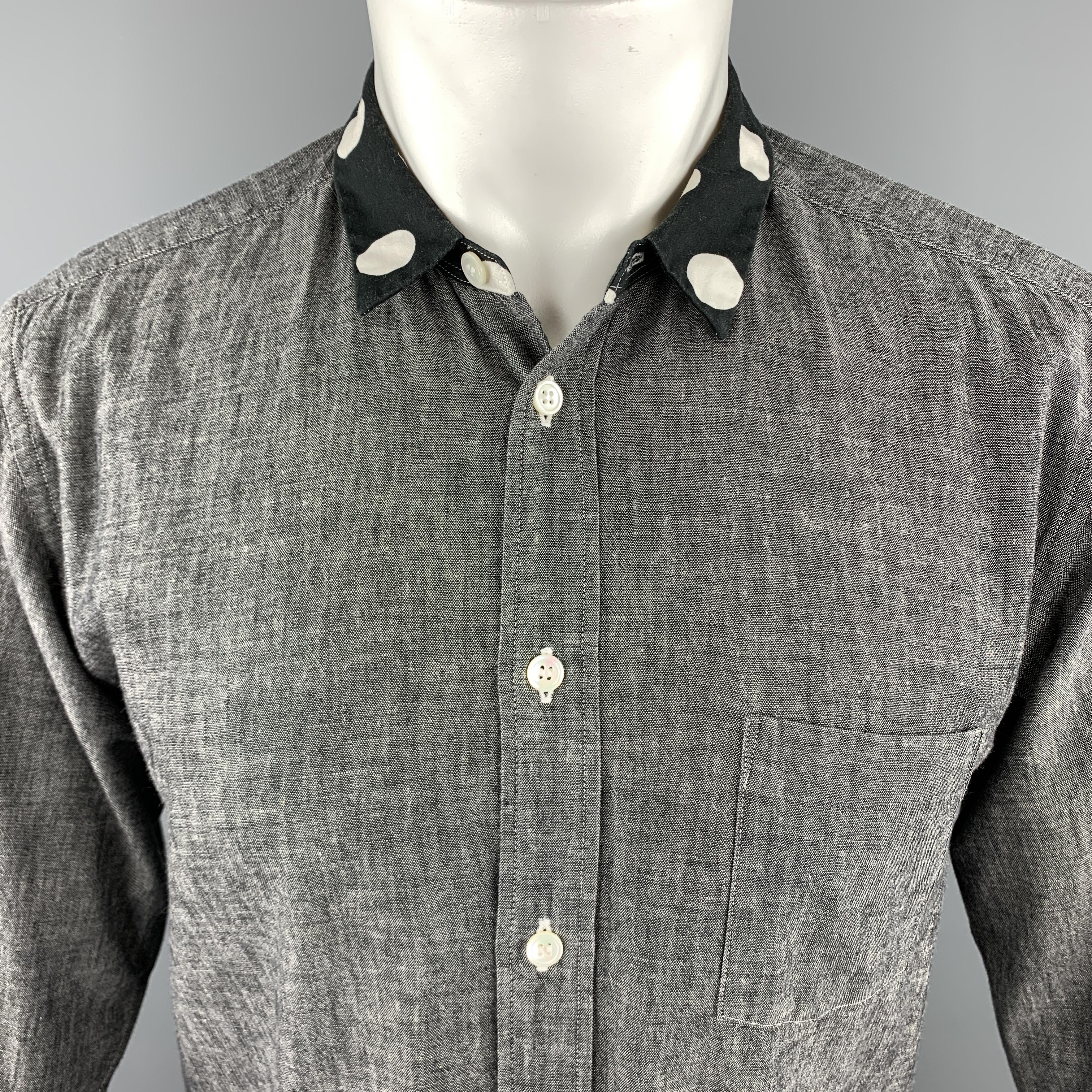 COMME des GARCONS HOMME PLUS long sleeve shirt comes in a solid gray cotton material, with a polka dots collar and cuffs, a patch pocket, and buttoned cuffs. Made in Japan.

Very Good Pre-Owned Condition.
Marked: XS  AD2011

Measurements:

Shoulder: