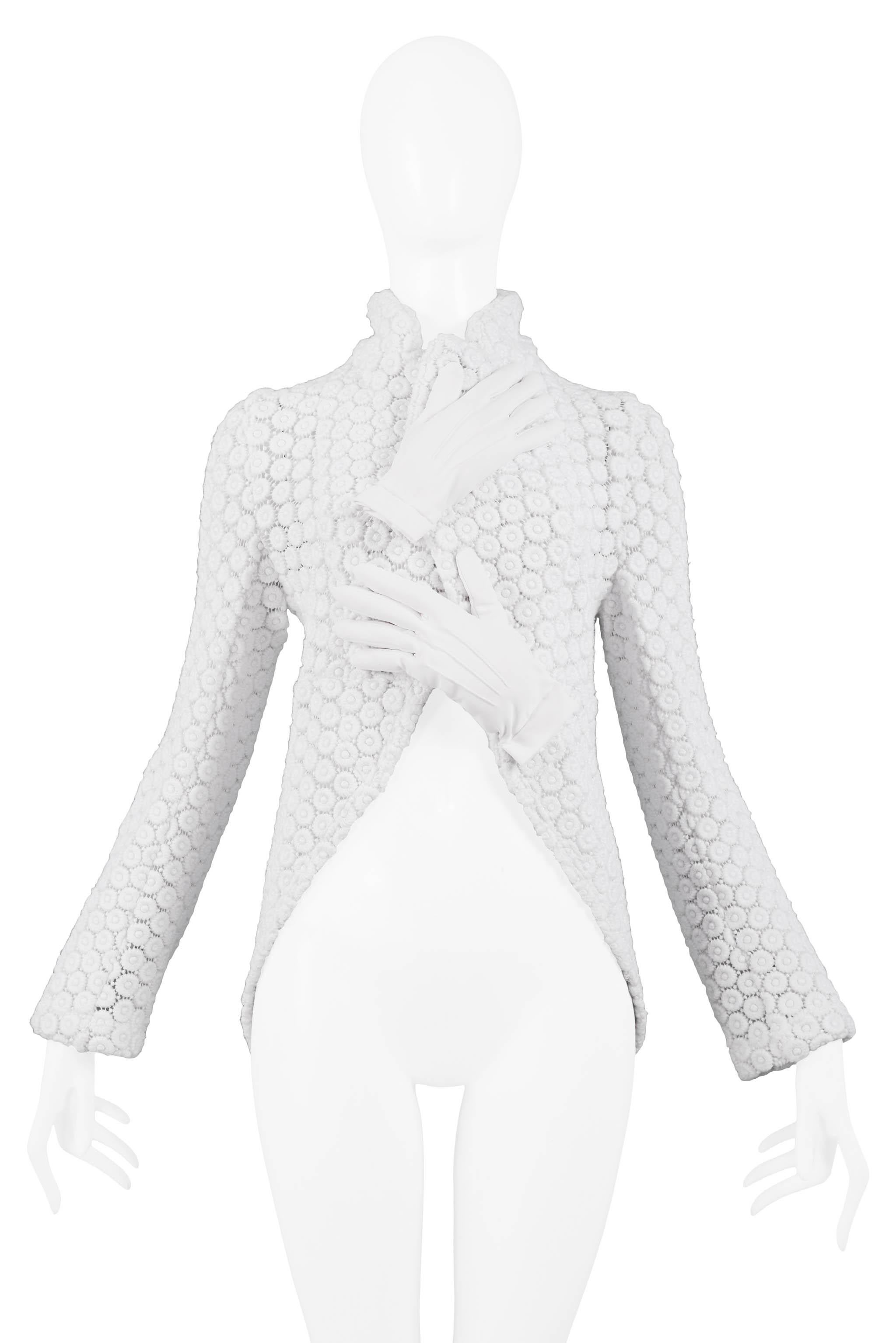 Resurrection Vintage is excited to offer a vintage Comme des Garcons white knit glove top featuring two white padded gloves, a fancy stretch knit, high collar, fitted bodice, and tuxedo style short front and longer back body. 

Size Medium
2007