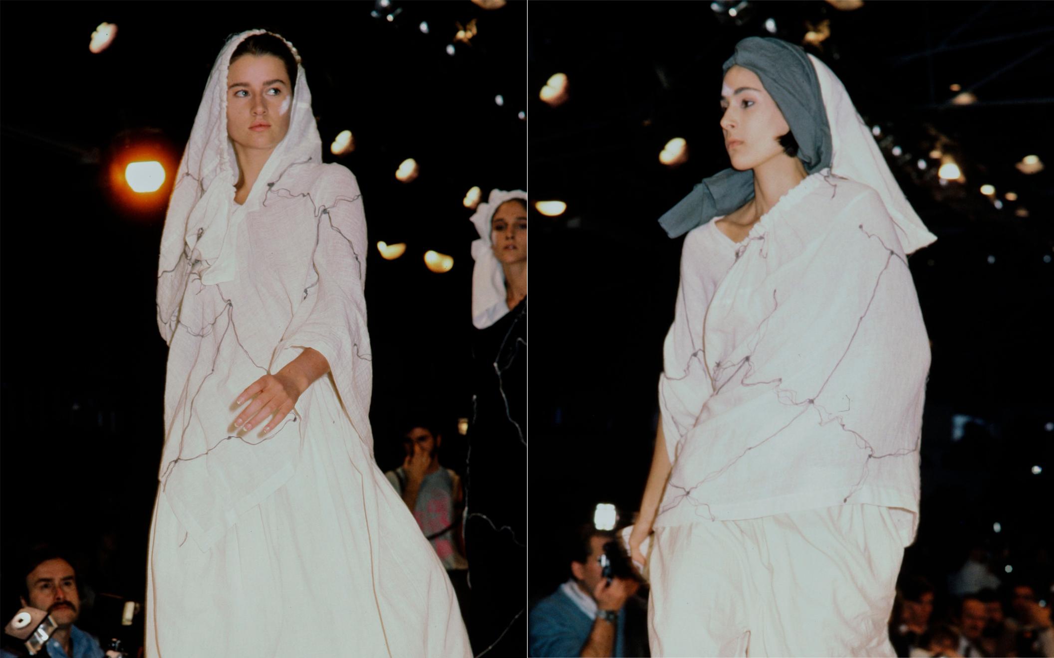 Comme des Garçons; Ivory muslin dress. Grey loosely stitched embroidery, large asymmetric drape on skirt, one armhole. Can be worn in various ways. 

Spring-Summer 1984