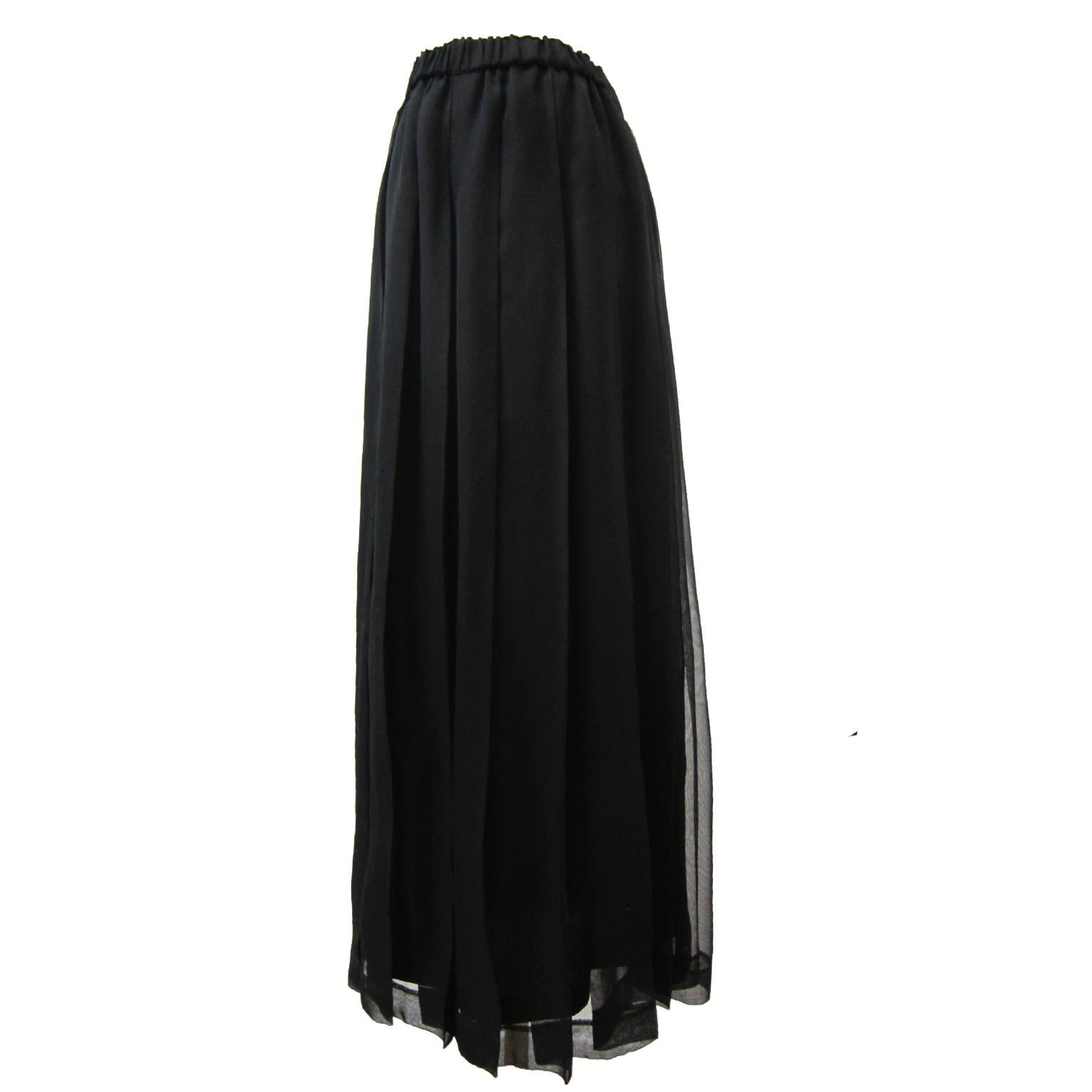 Comme des Garcons robe de chambre black layered sheer skirt from AD 1996.
This layered pleated skirt was made with two layers featuring elastic waist, max-length pleated sheer and an under layered design panel. 
Measurements : 
Length : 92 cm
Waist