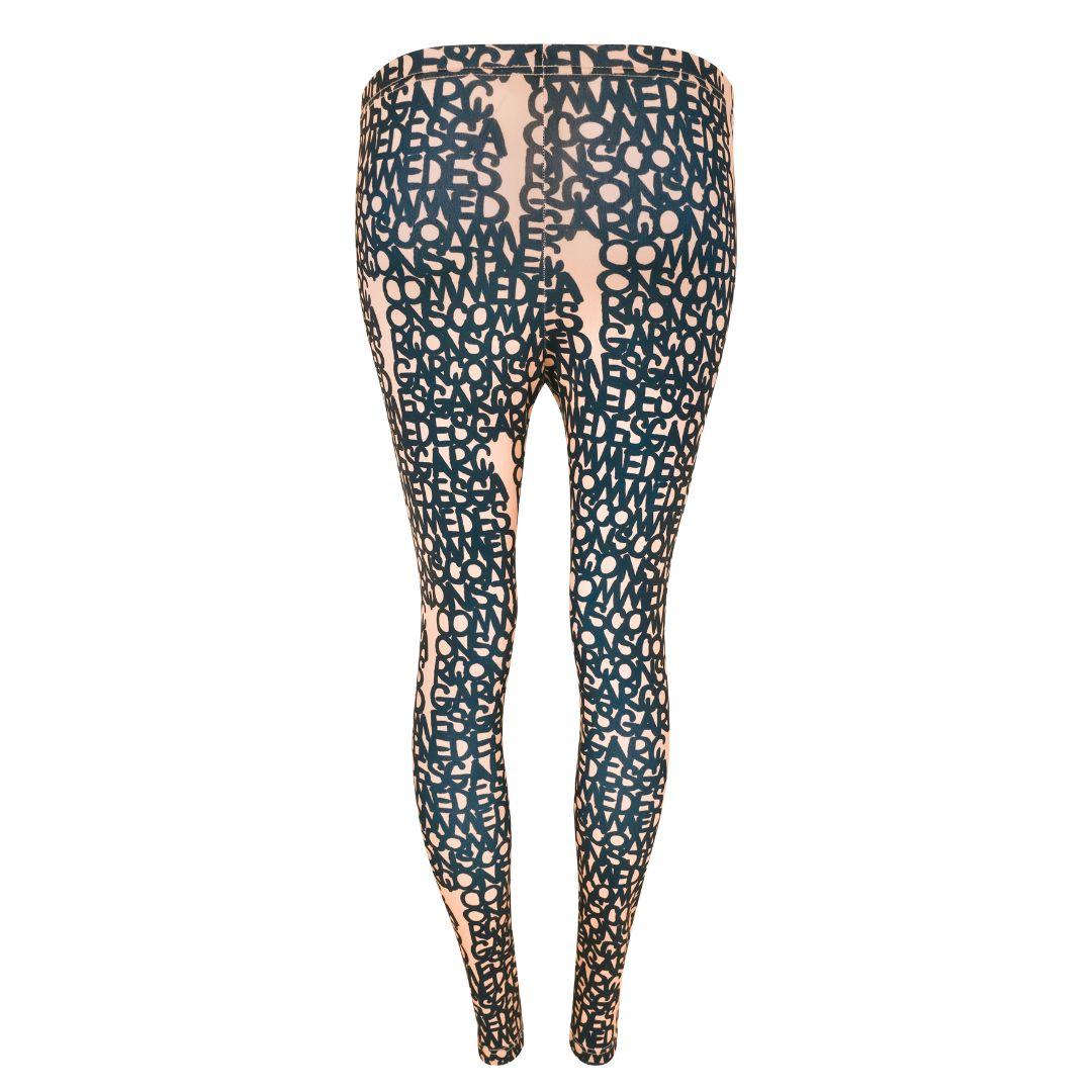 Comme Des Garçons graffiti print leggings featuring logo print in navy blue and tan. Elasticized waistband and slim fit with stretch. 

Condition Details: Good condition consistent with wear and use. The leggings have been softened and slightly