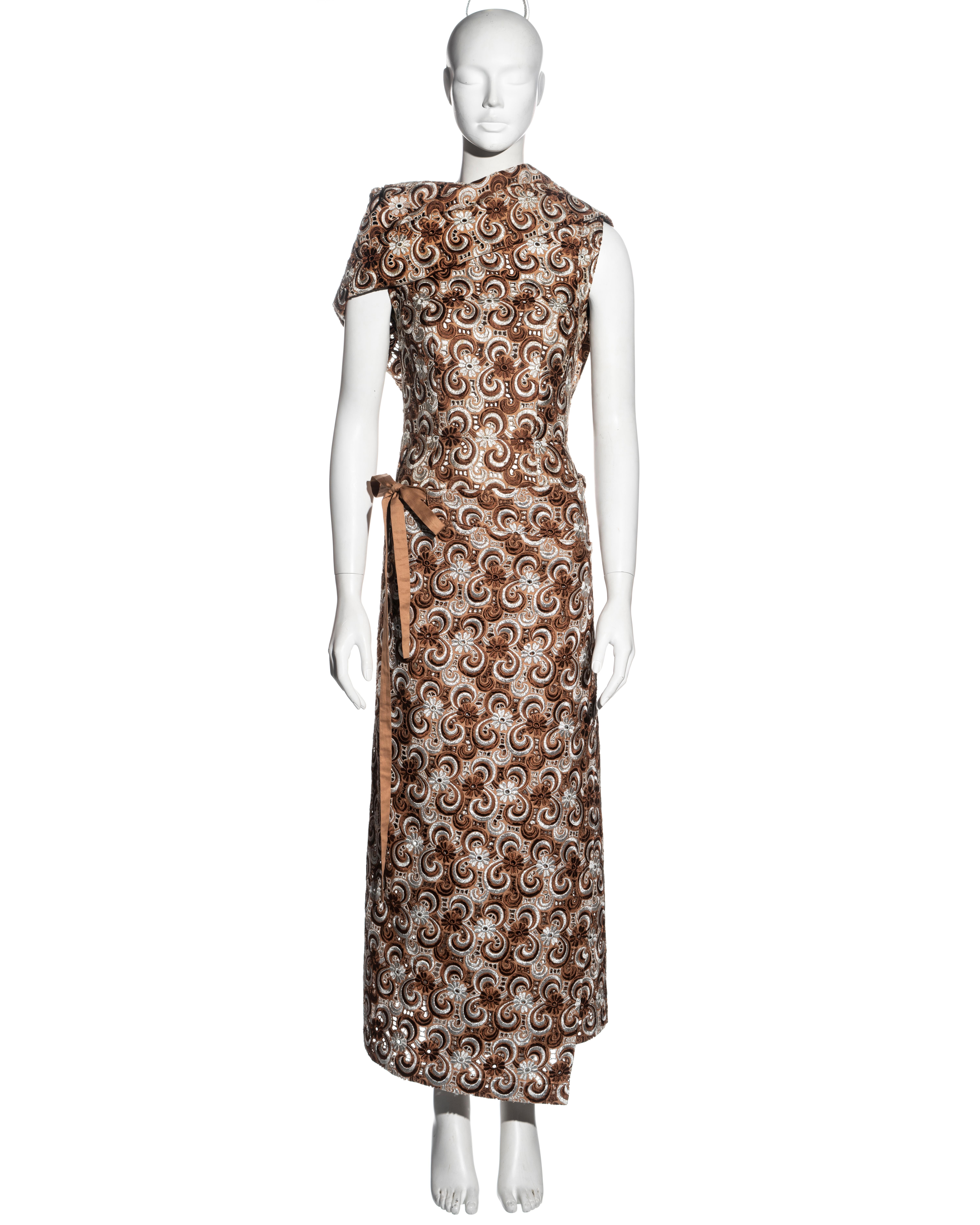 ▪ Comme des Garçons dress and skirt set 
▪ Lurex voile lace in brown, silver and cream 
▪ Mid-length wrap dress 
▪ Large turn-over collar 
▪ Two large safety pin closures at the back 
▪ Maxi wrap skirt with ribbon ties 
▪ Size Medium
▪ Fall-Winter