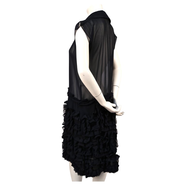 COMME DES GARCONS - A NAVY DRESS WITH A WHITE FLORAL PATTERN