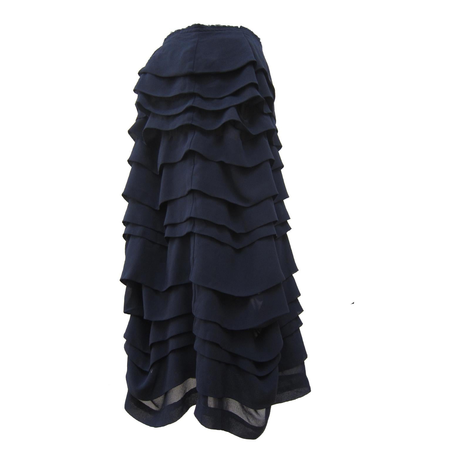 Comme Des Garçons ruffle layered beautifully volumed skirt from AD 2004. Featuring layers of folded ruffles stitching throughout with unfinished waist line. 
Size : M
Waist : 37 cm
Length : 66 cm

