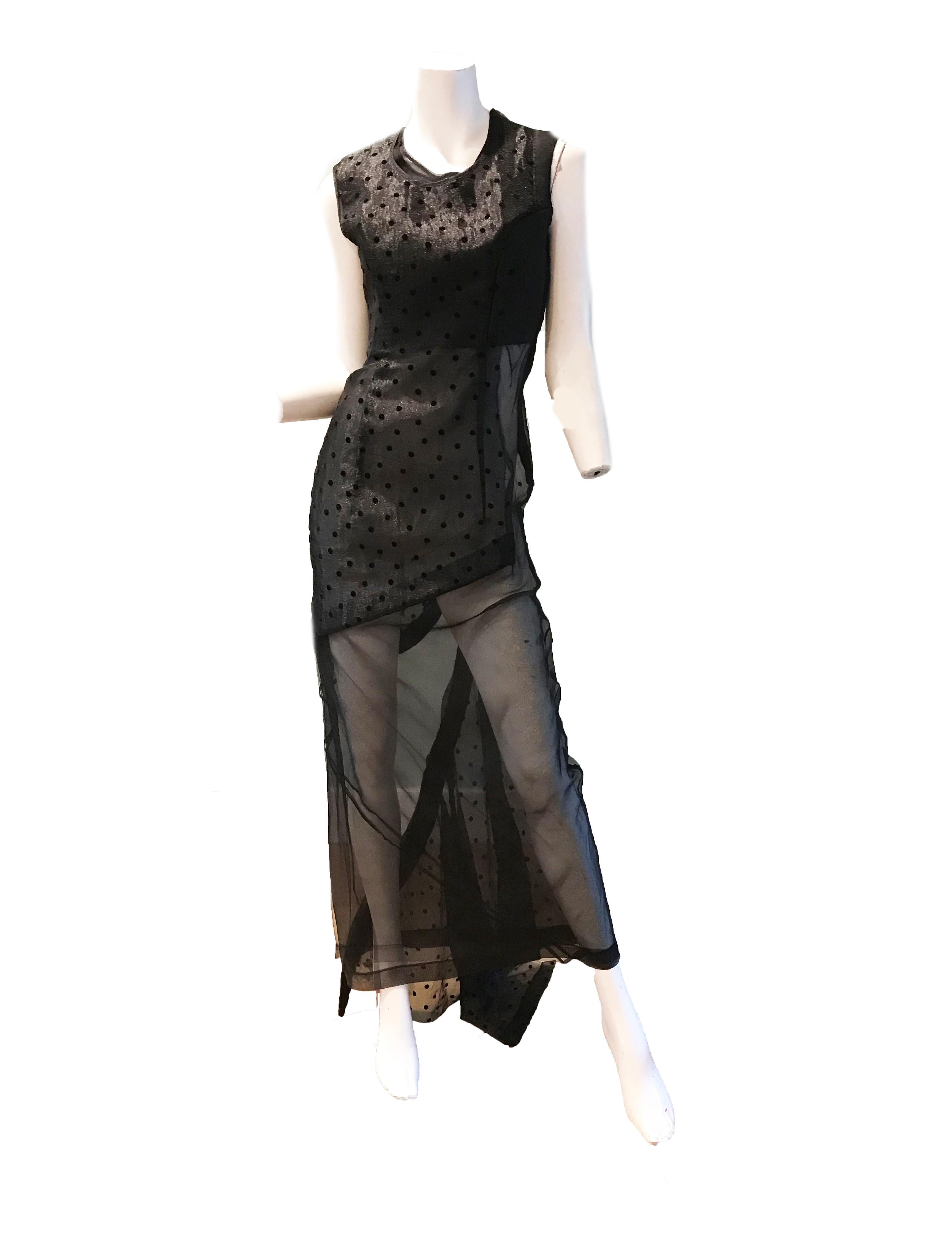 Comme des Garcons black net evening gown . Size S
Condition: Good, tear at hem. See photos 