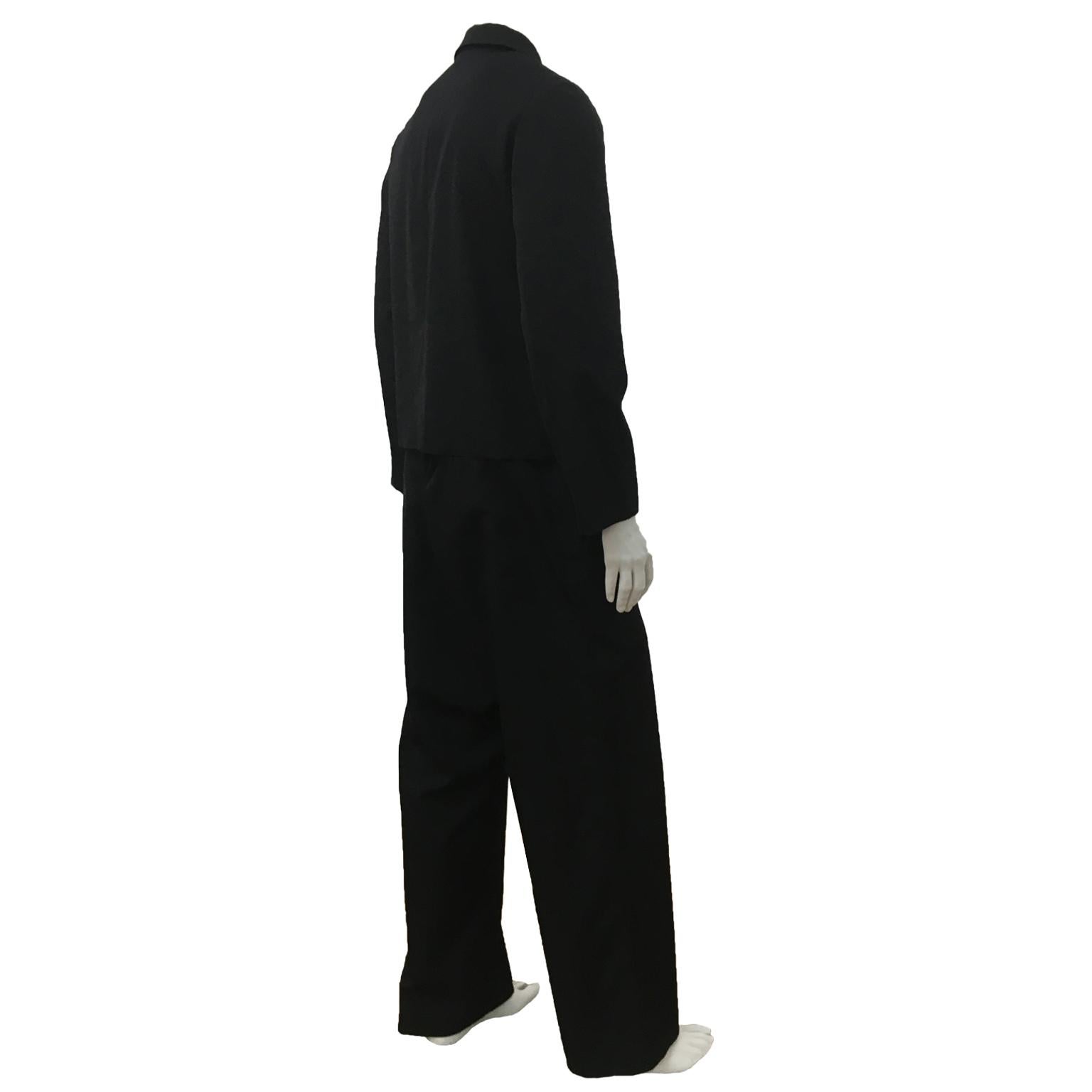 Comme des Garcons black gabardine set up suit from AD 1995. White painted print across the front of jacket and trouser. 
The trouser can be worn loosely as it was intended and belted.
Measurements ; 

Shoulder : 42 cm 
sleeve : 63 cm
length 61