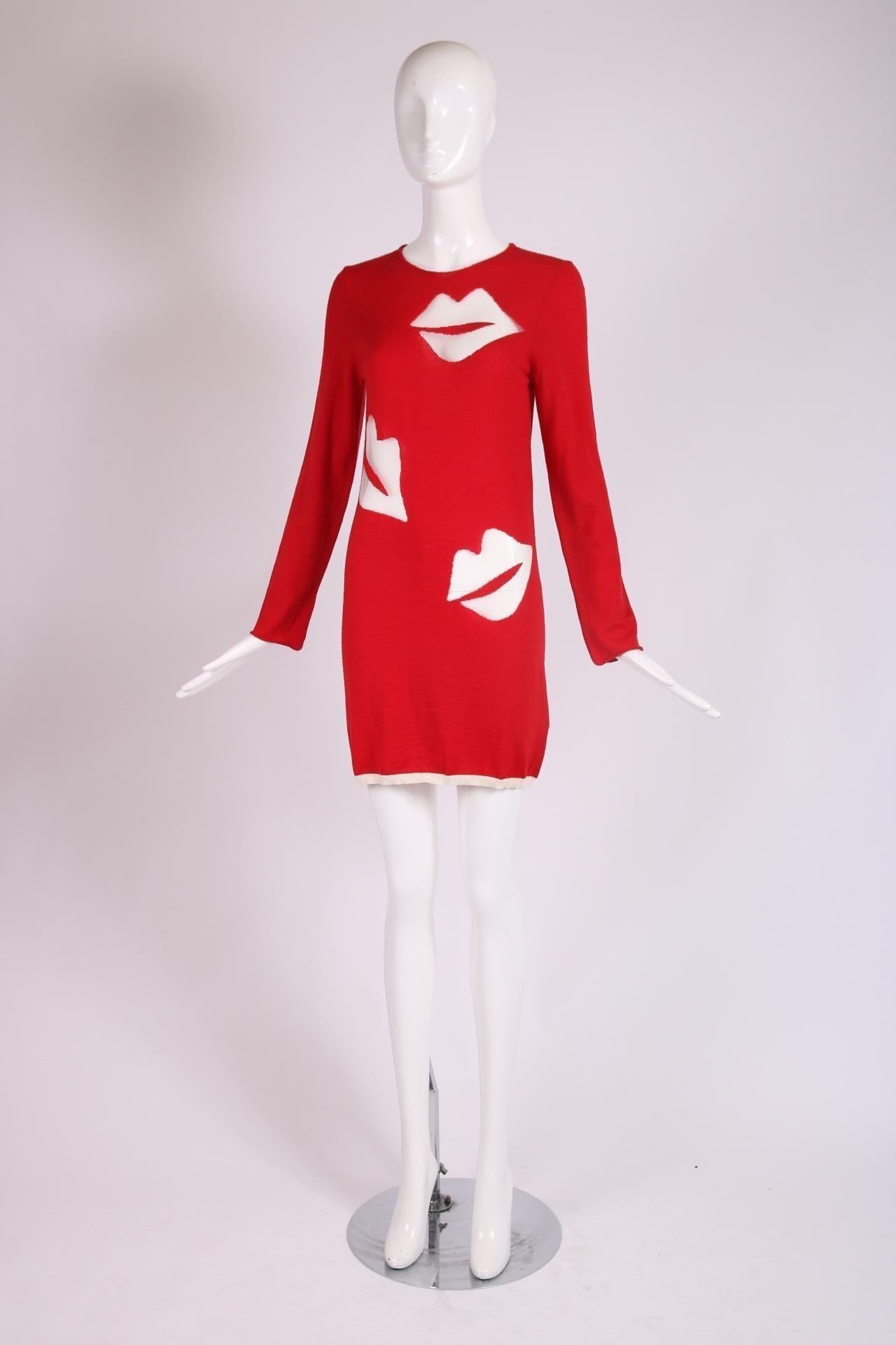 2008 Comme des Garcons red wool sweater dress or just oversized sweater with long sleeves, white cotton trim at the hem and transparent nylon lip motif throughout. Size S, in excellent condition. Please consult measurements.
Bust - 33