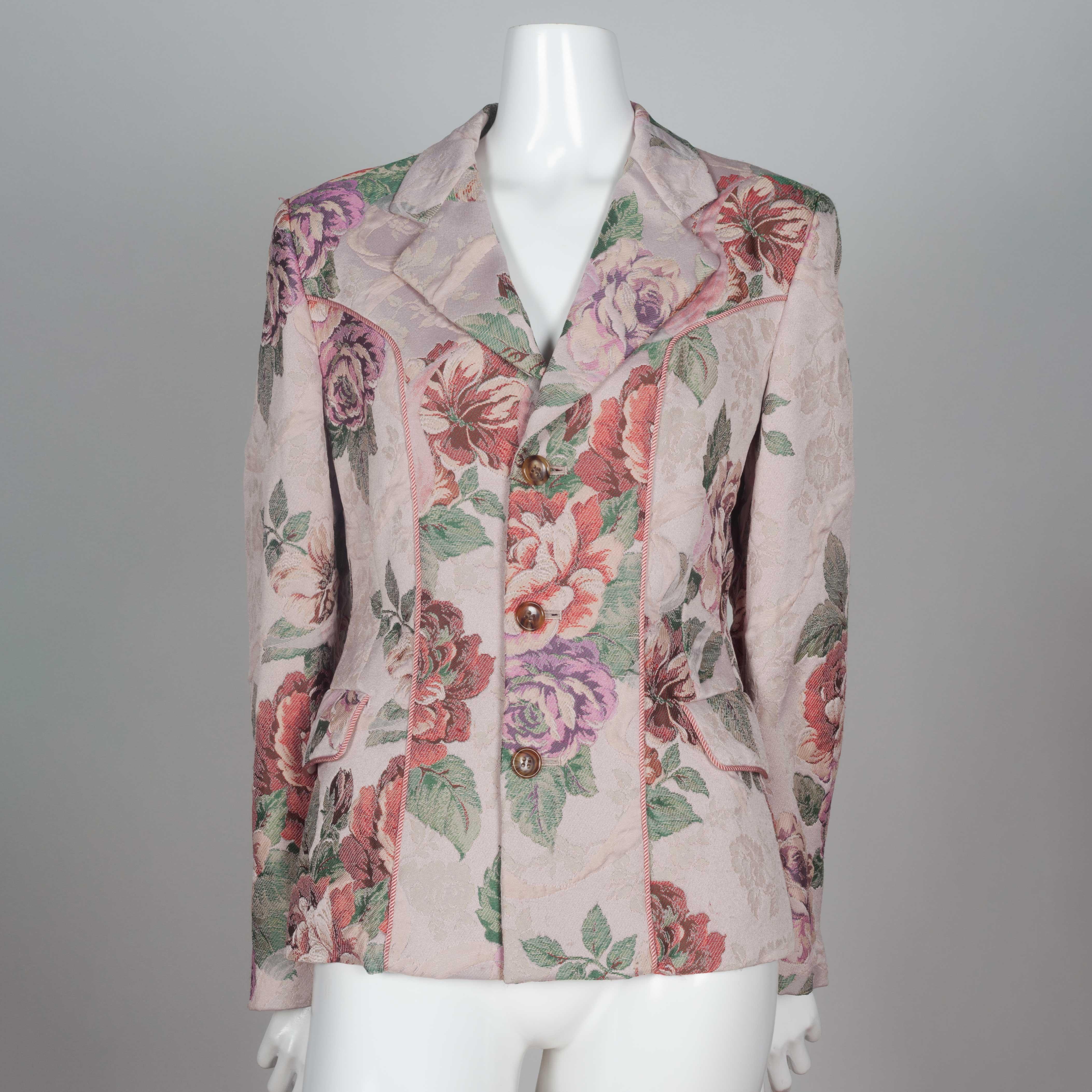 Comme des Garçons Robe de Chambre 1999 single breasted jacket in floral tapestry material with pink vertical cording on front chest and around pocket flaps. Manufacture des Gobelins (The Gobelins Manufactory) weaved the material for this jacket