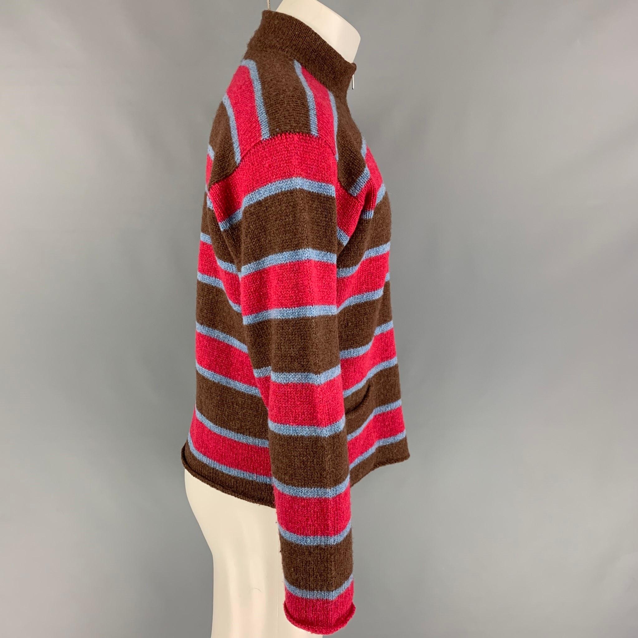 COMME des GARCONS SHIRT jacket comes in a brown & red stripe wool featuring a high collar, front pockets, and a full zip up closure. 

Very Good Pre-Owned Condition.
Marked: S

Measurements:

Shoulder: 21.5 in.
Chest: 45 in.
Sleeve: 24 in.
Length: