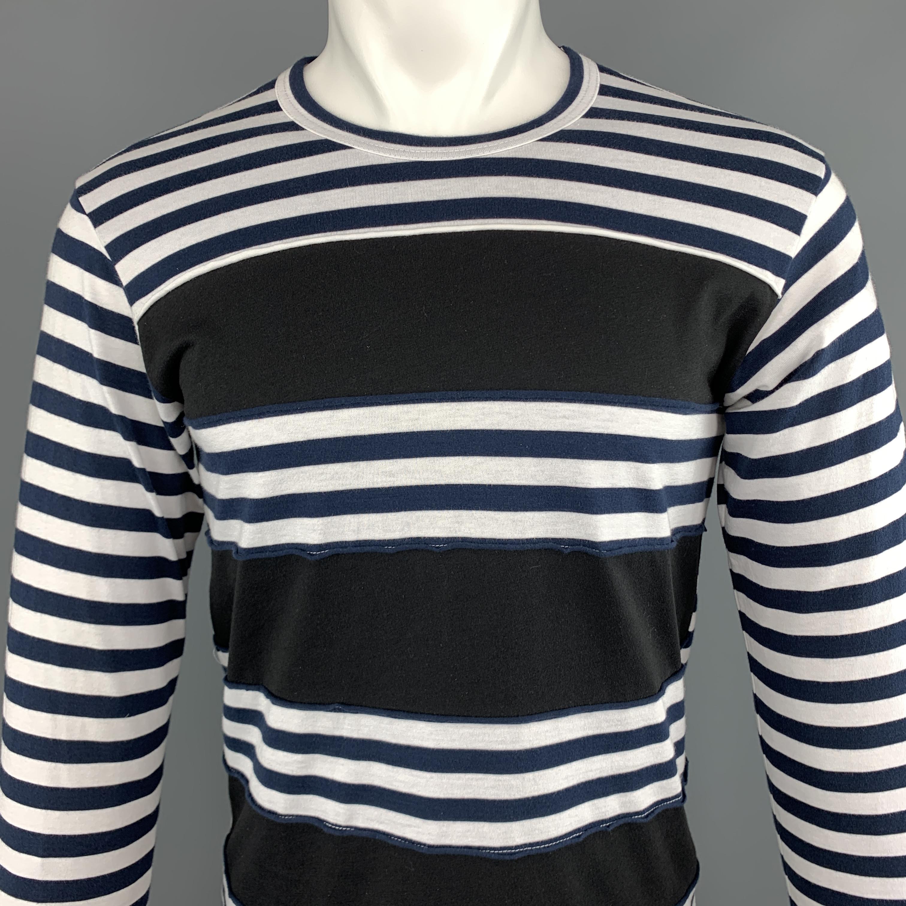 COMME des GARCONS SHIRT long sleeve tee comes in navy and white striped cotton jersey with frayed black stripe panels and crewneck.
 
New with Tags.
Marked: S
 
Measurements:
 
Shoulder: 17 in.
Chest: 17 in.
Sleeve: 25 in.
Length: 27 in.