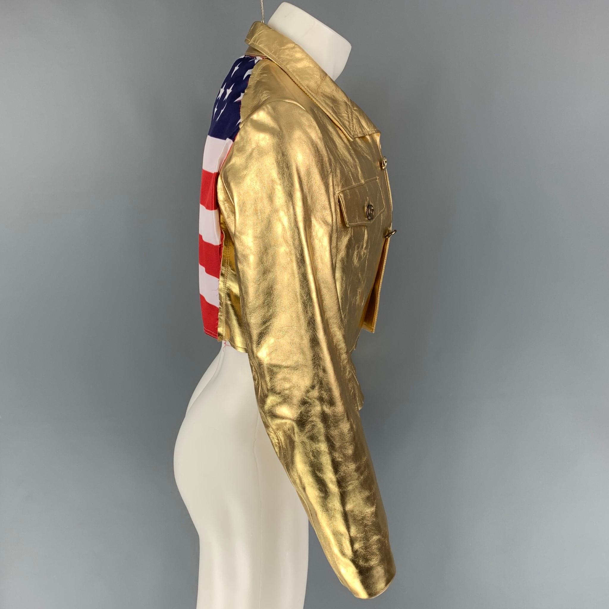 COMME des GARCONS jacket comes in a gold metallic leather featuring a pointed collar, front pockets, cropped, and a buttoned closure. Jacket has been customized with a american flag design. Made in Japan. 

Very Good Pre-Owned Condition. Minor seam
