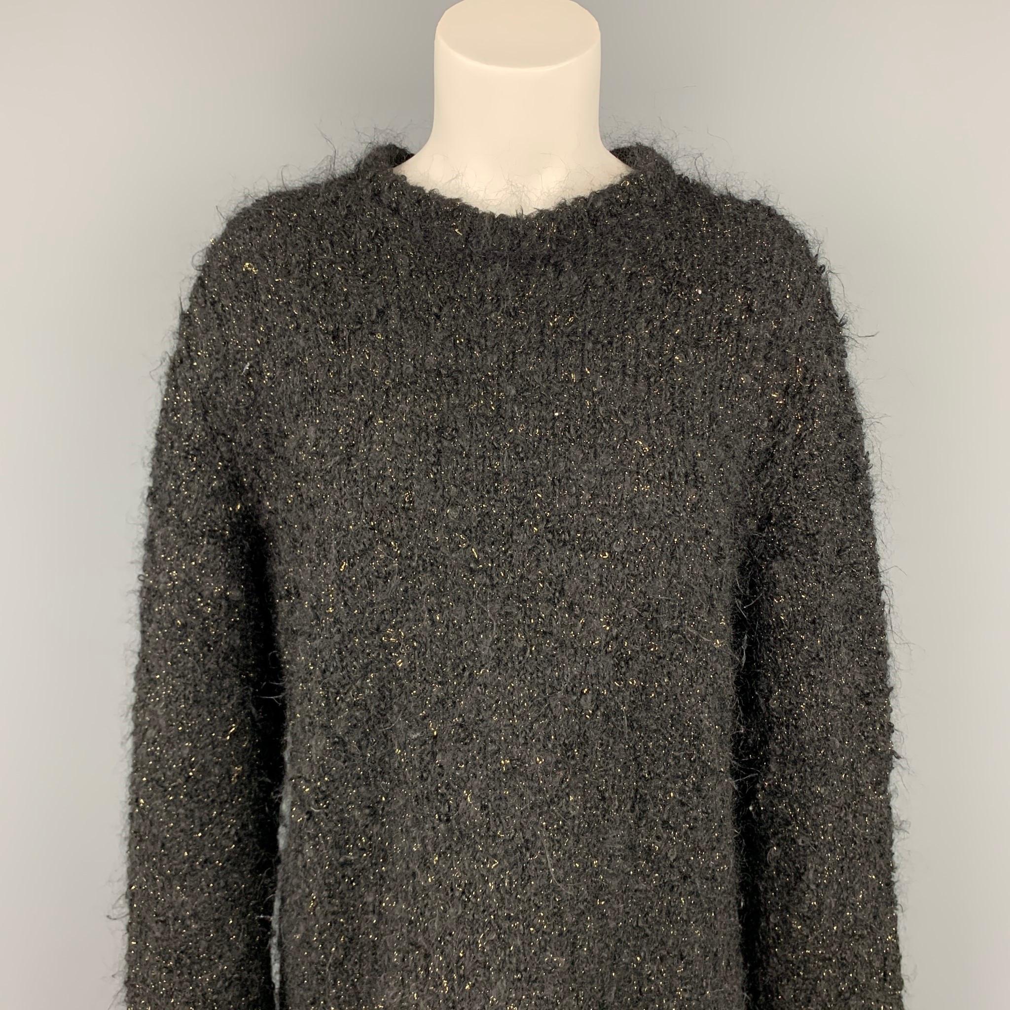 COMME des GARCONS sweater comes in a black & gold wool / polyester featuring a oversized style and a crew-neck. Made in Japan.

Very Good Pre-Owned Condition.
Marked: L

Measurements:

Shoulder: 19 in.
Bust: 42 in.
Sleeve: 28 in.
Length: 24 in. 
