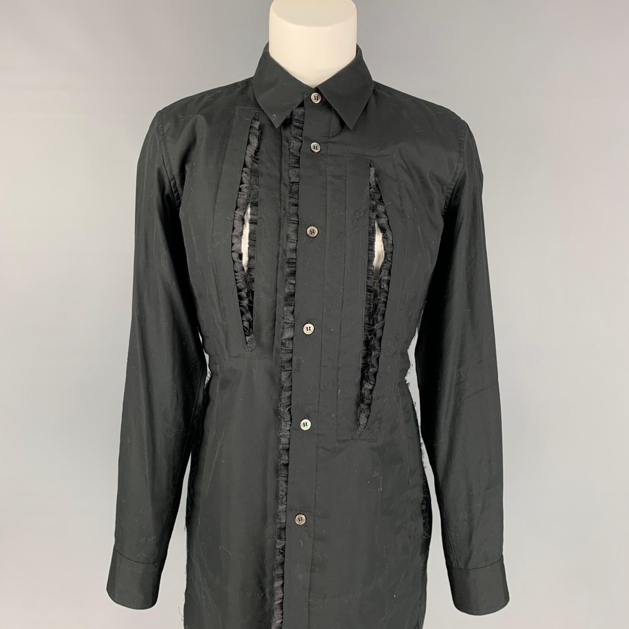 COMME des GARCONS blouse comes in a black cotton featuring a front cut-out design, spread collar, ruffle trim, and a buttoned closure. Made in Japan. 

Very Good Pre-Owned Condition.
Marked: M / AD2017

Measurements:

Shoulder: 16 in.
Bust: 38