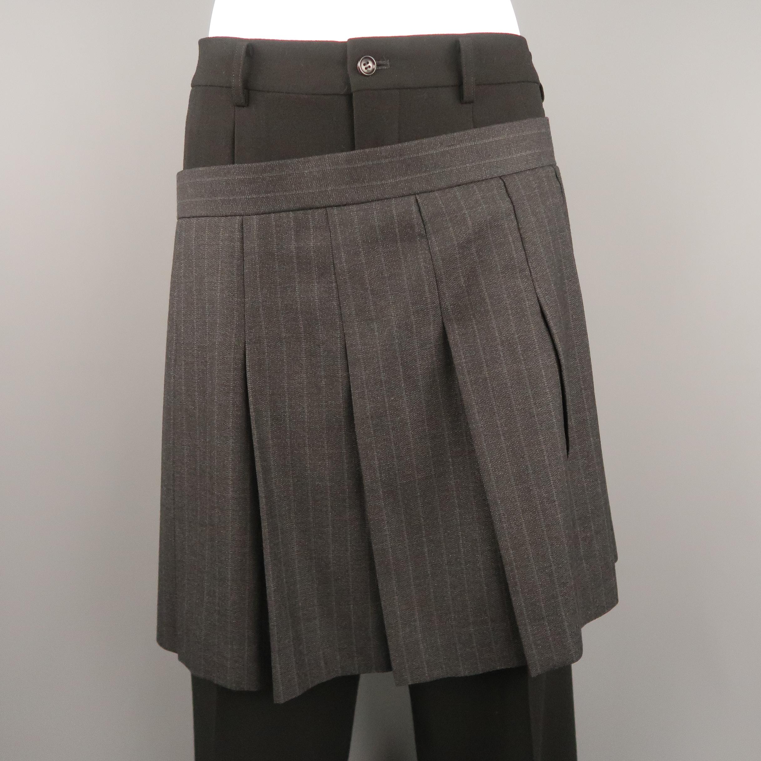 Women's Archive COMME des GARCONS Fall Winter 2004 Collection runway trousers come in black wool blend fabric with a relaxed leg and backwards pinstripe box pleated skirt overlay attached at raw edged side zipper that rests, layered at the hip.