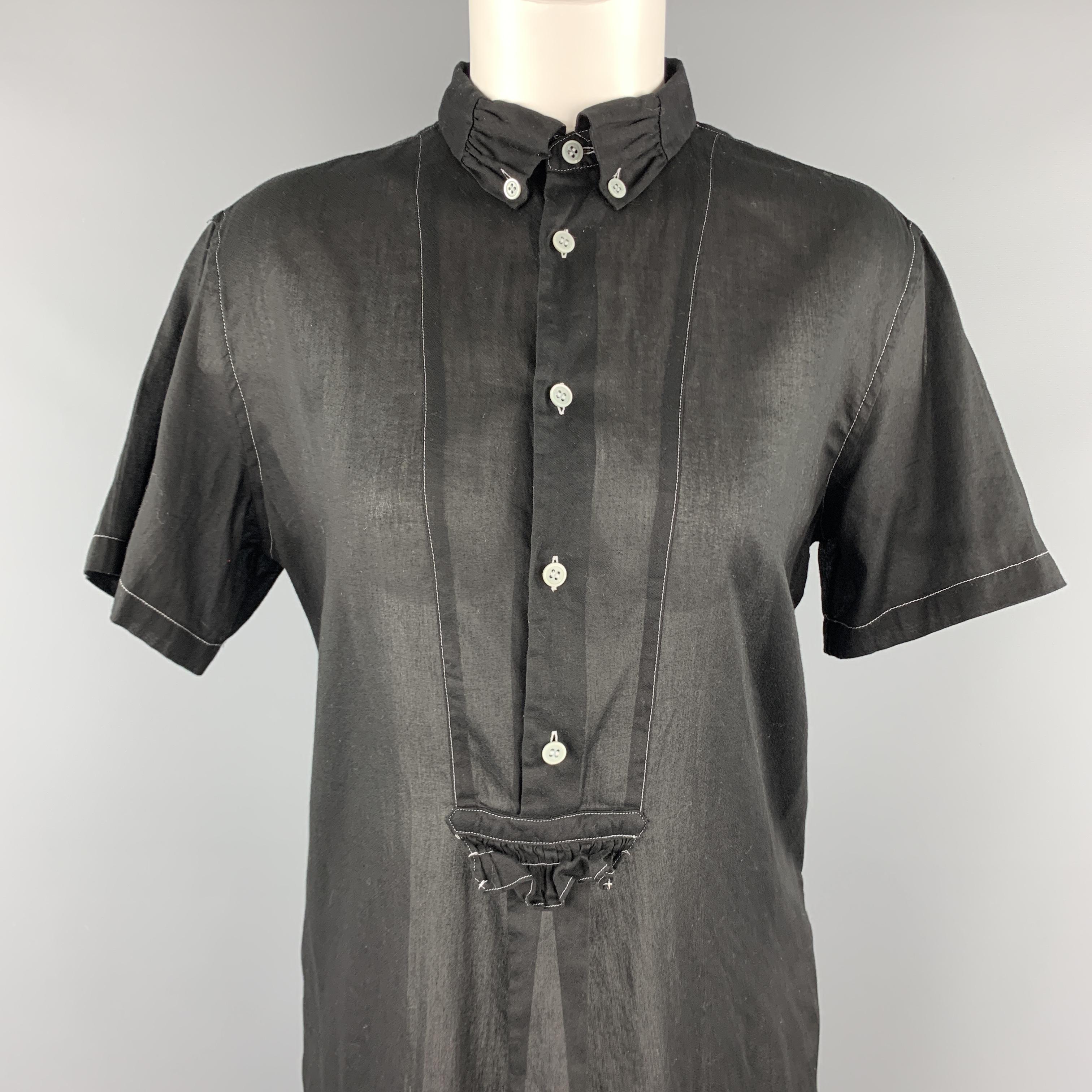 COMME des GARCONS TRICOT shirt dress comes in sheer black cotton with an oversized A line silhouette, ruffle detailed button down collar, and contrast stitching throughout. Made in Japan.

Excellent Pre-Owned Condition.
Marked: M  AD