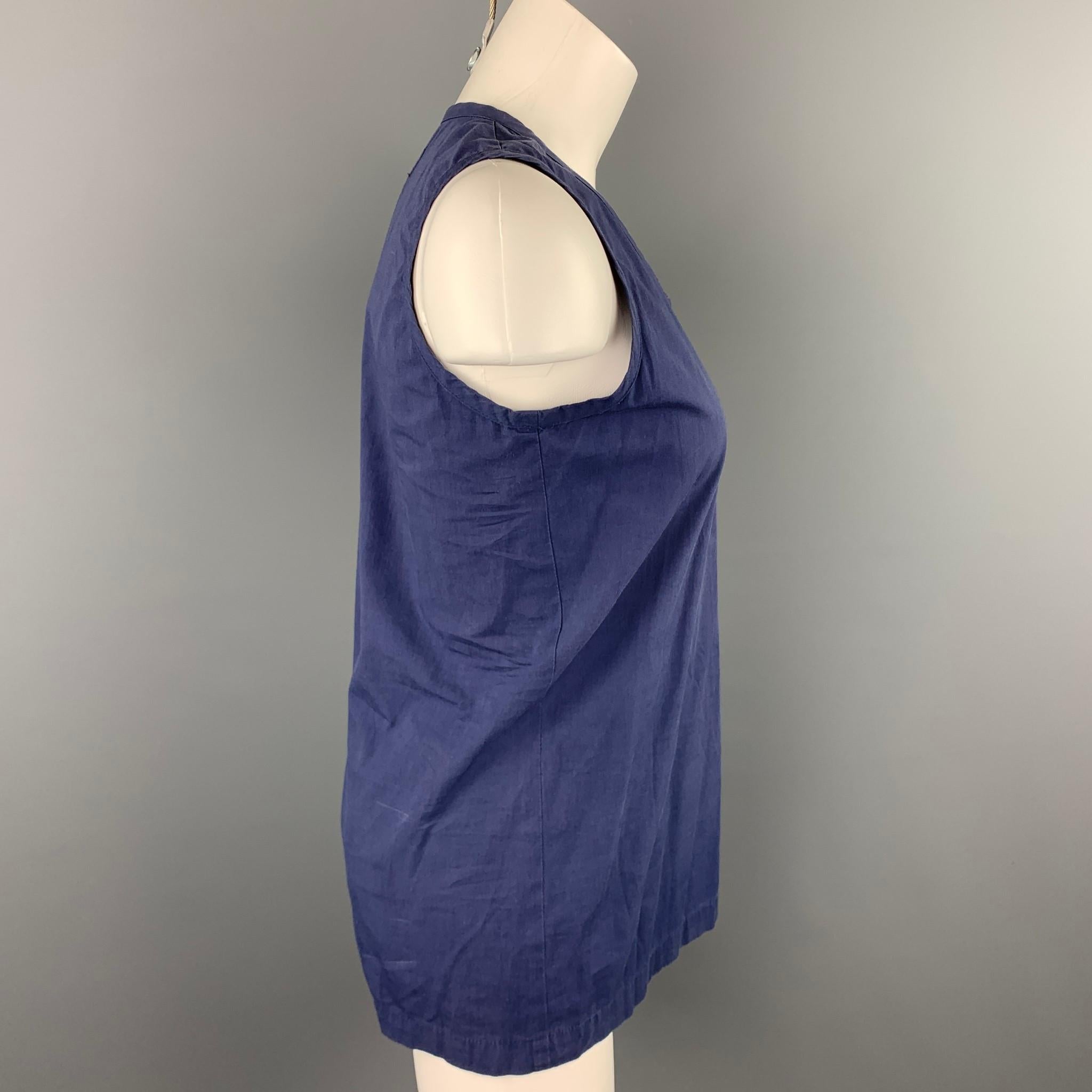 COMME des GARCONS tank top comes in a blue cotton featuring a scoop neck. Discoloration throughout. As-Is. Made in Japan.

Fair Pre-Owned Condition.
Marked: No size marked

Measurements:

Shoulder: 12 in. 
Bust: 36 in. 
Length: 26 in. 