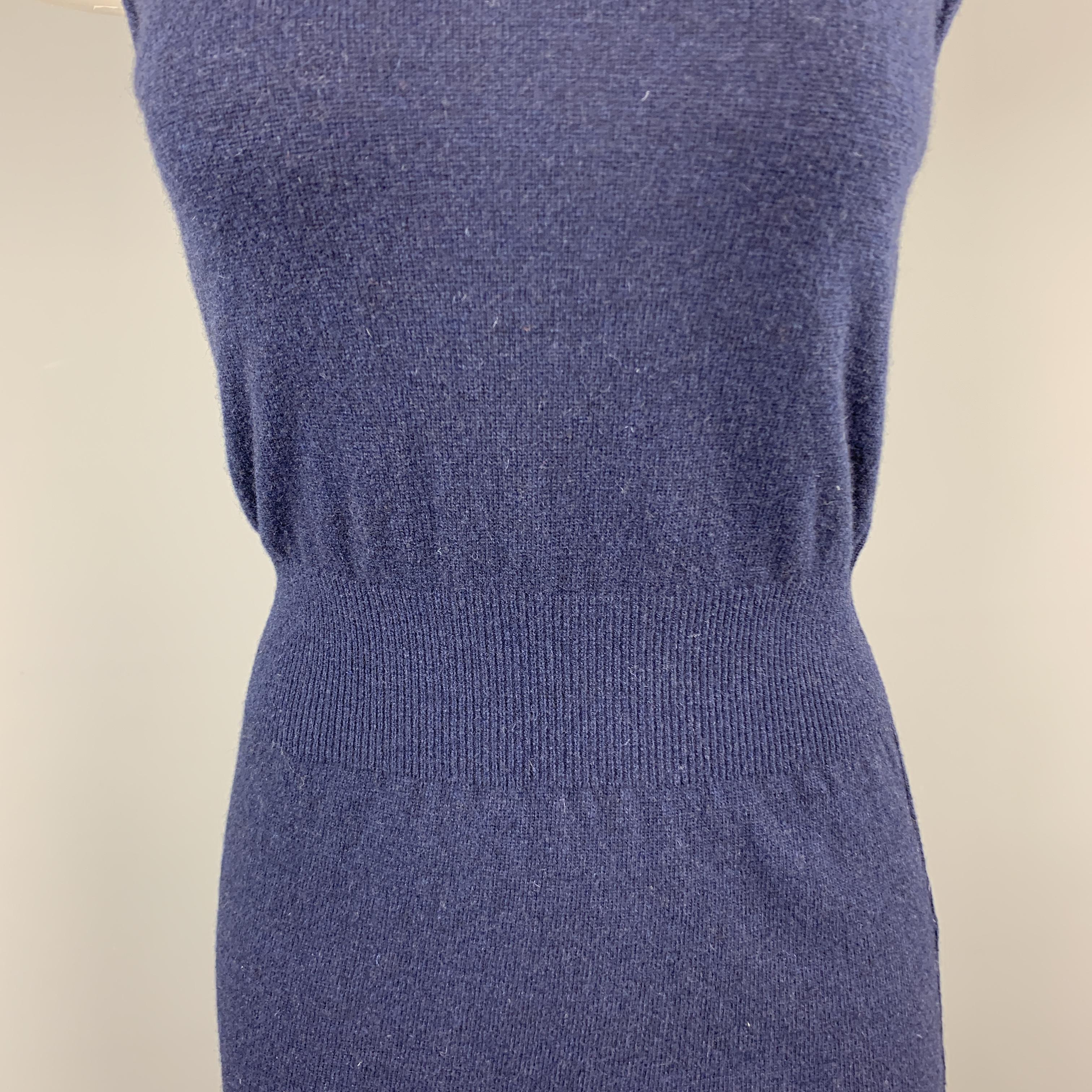 COMME des GARCONS tank top comes in navy wool blend knit with a scoop neck and cinched waistband. Made in Japan.

Very Good Pre-Owned Condition.
Marked: M

Measurements:

Shoulder: 12 in.
Bust: 33 in.
Length: 28 in.