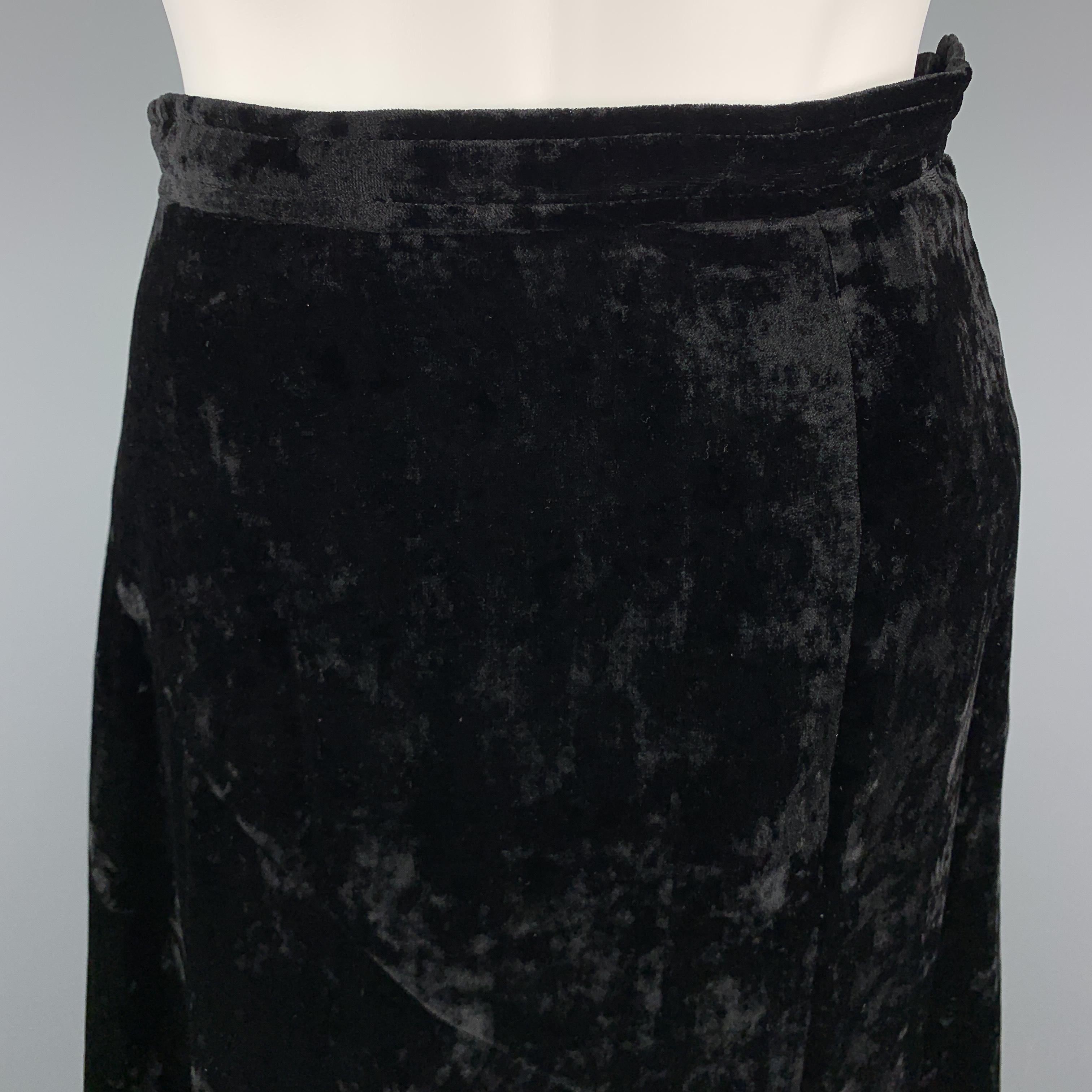 COMME des GARCONS Asymmetrical Skirt comes in a black solid polyester / rayon velvet material, in a knee length, featuring large black beads and a side zipper. Made in Japan.

Excellent Pre-Owned Condition.
Marked: S

Measurements:

Waist: 25 in.