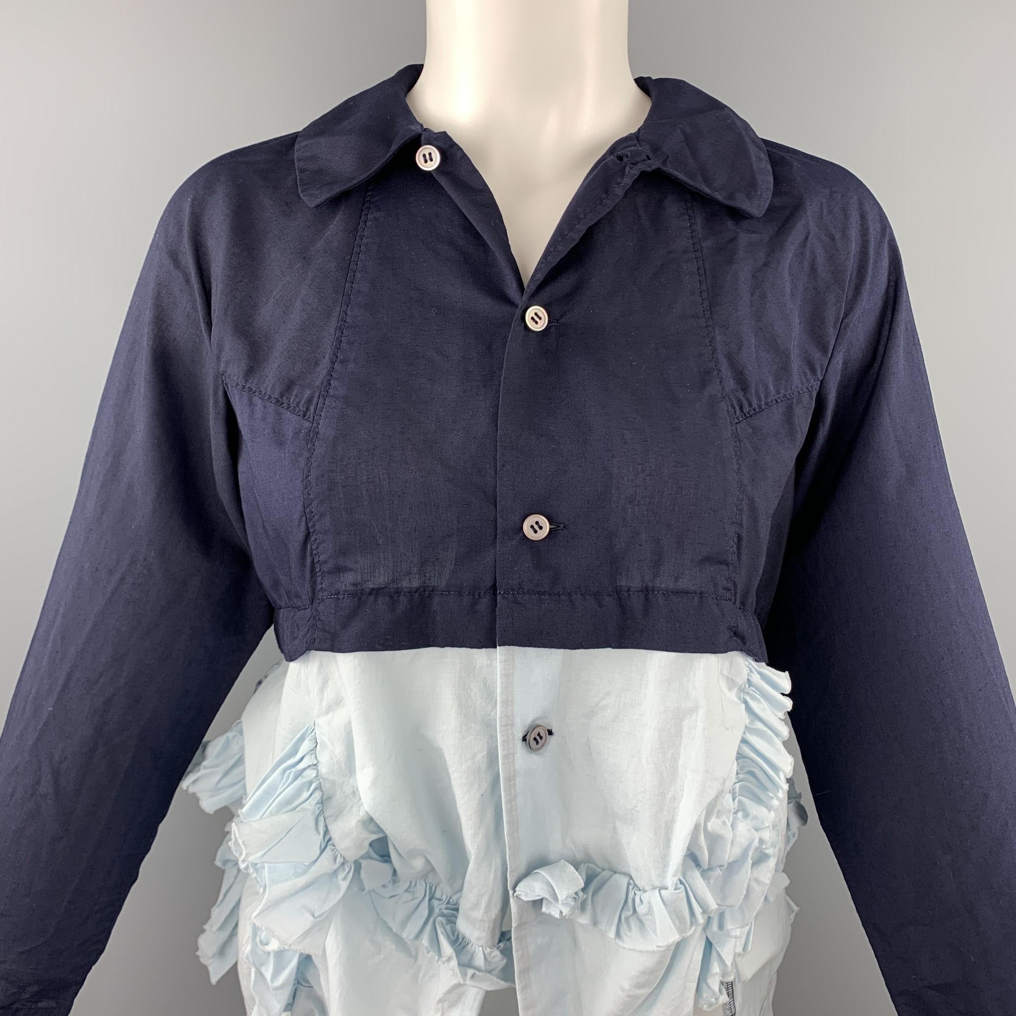 COMME des GARCONS dress top comes in a navy cotton with a light blue ruffled design featuring a button up style and a spread collar. Made in Japan.

Very Good Pre-Owned Condition.
Marked: XS / AD 2015

Measurements:

Shoulder: 17 in. 
Bust: 34