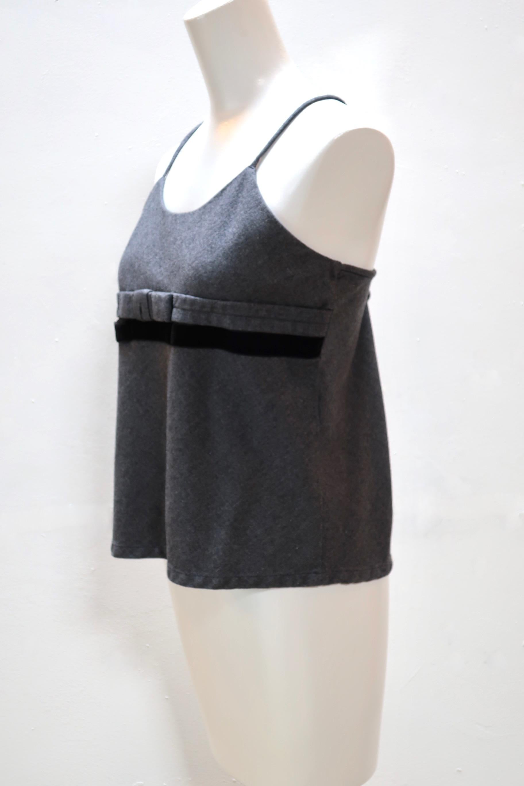 A basic grey wool tank top is elevated with a grey bow and a black velvet ribbon bow beneath the bustline.  