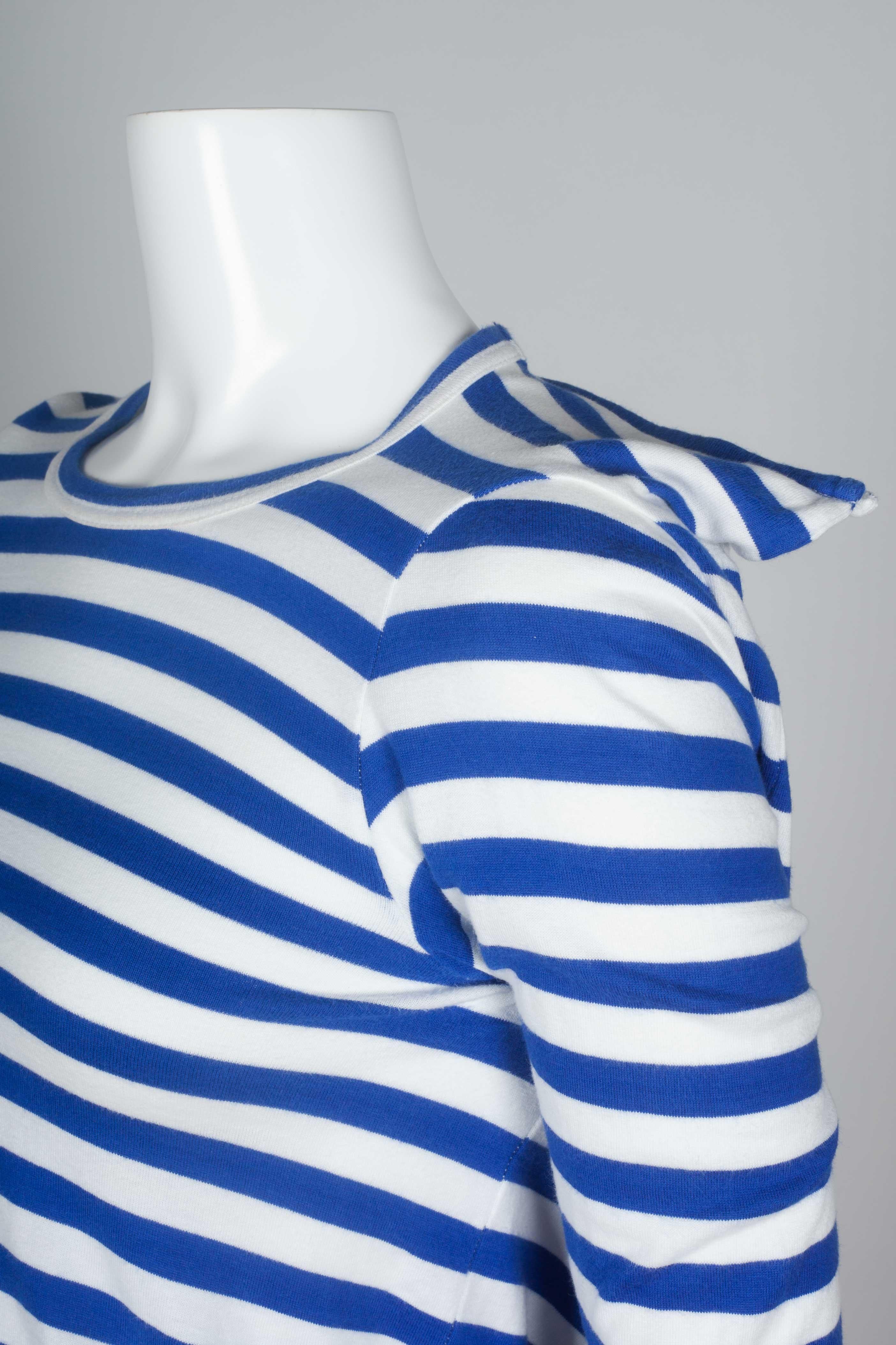 Comme des Garçons 2007 long sleeve blue nautical striped shirt cut from a square pattern, revealing two of its corners at the shoulders. French marinière stripes, Jean-Paul Gaultier style. 

YEAR: 2007
MARKED SIZE: 
FIT: Regular 
US WOMEN'S: XS
US