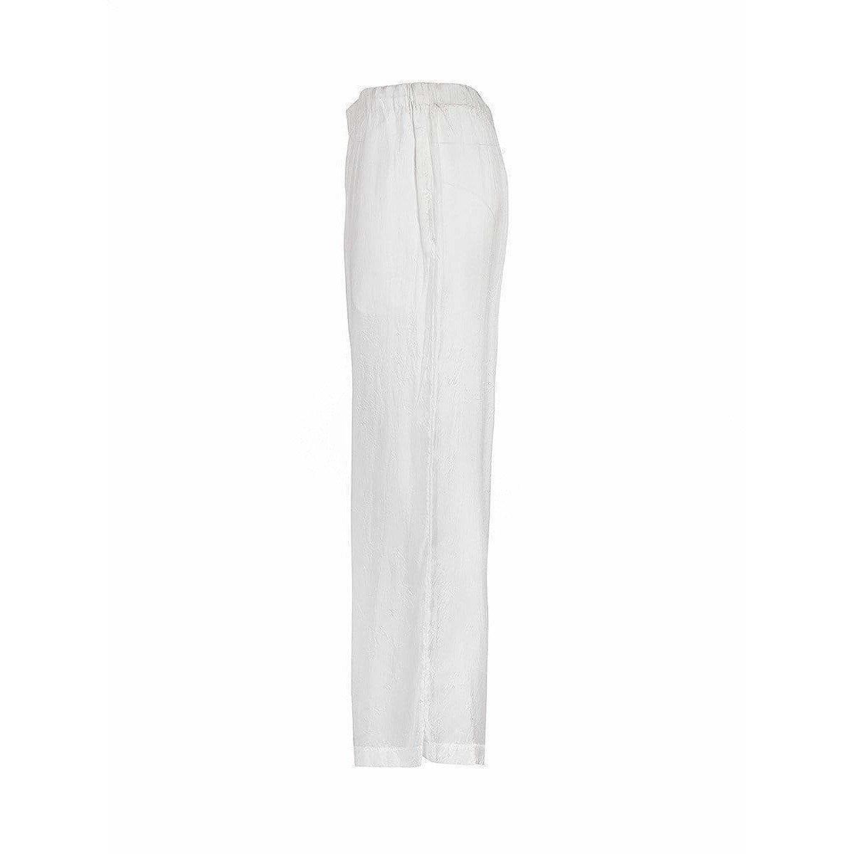 Soft silk straight leg pant in white has side seam pockets, side seam slits at the ankle and a comfortable elastic waist, with inner drawstring tie, from vintage Comme des Garçons.
