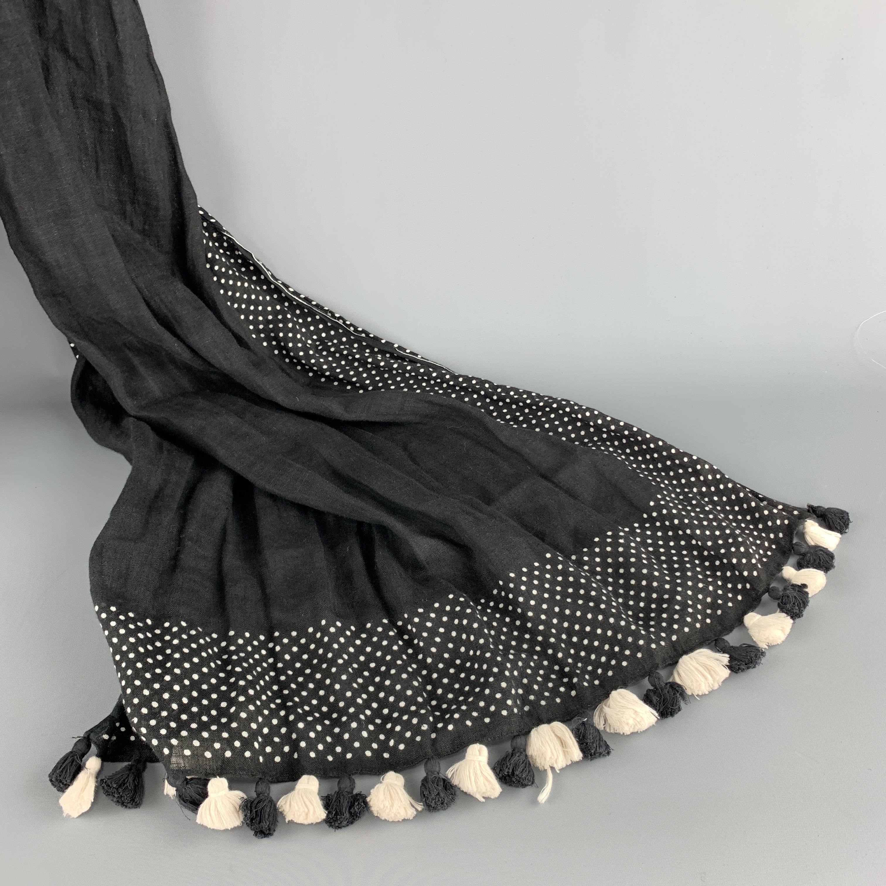 COMME des GARCONS TRICOT shawl scarf comes in black and white speckled linen with micro polka dot panels and tassel fringe trim. 

Excellent Pre-Owned Condition.

Length: 70 in.
Width: 29 in.
