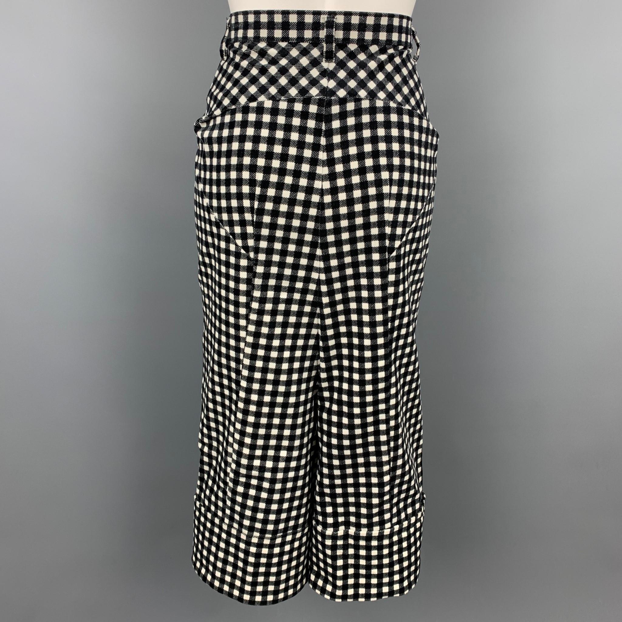 COMME des GARCONS TRICOT casual pants comes in a black & white checkered gingham velvet featuring a drop crotch style, wide leg, and a zip fly closure. Made in Japan.

Very Good  Pre-Owned Condition.
Marked: S / AD2014

Measurements:

Waist:  28