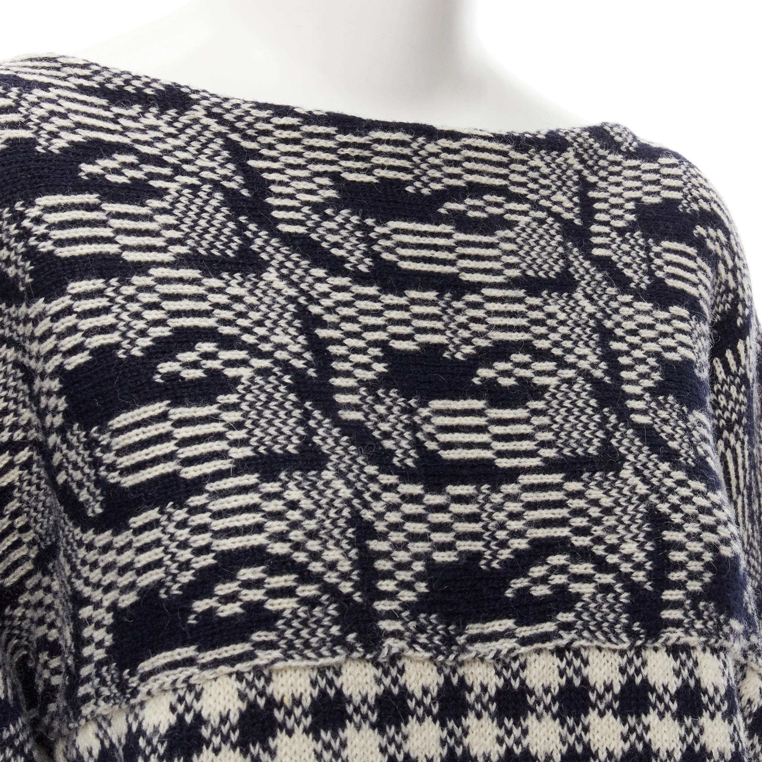COMME DES GARCONS Tricot Vintage 1980s grey intarsia checker sweater M 
Reference: CRTI/A00605 
Brand: Comme Des Garcons 
Designer: Rei Kawakubo 
Collection: Tricot 
Material: Wool 
Color: Grey 
Pattern: Mixed 
Extra Detail: Curled edges. Mixed