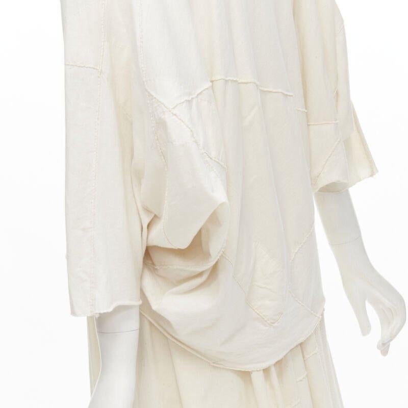 COMME DES GARCONS TRICOT Vintage raw cotton patchwork trapeze top midi skirt
Reference: CRTI/A00681
Brand: Comme Des Garcons
Designer: Rei Kawakubo
Material: Cotton
Color: White
Pattern: Solid
Closure: Zip
Extra Details: Top: Raw cotton patchwork